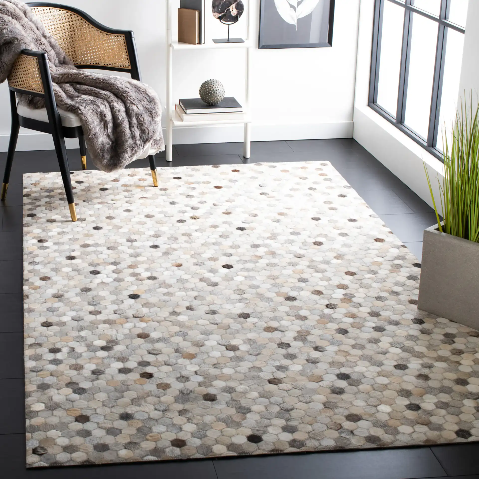 Studio Leather Honeycomb Patchwork Hand-Woven Rug in Ivory / Gray in a styled room