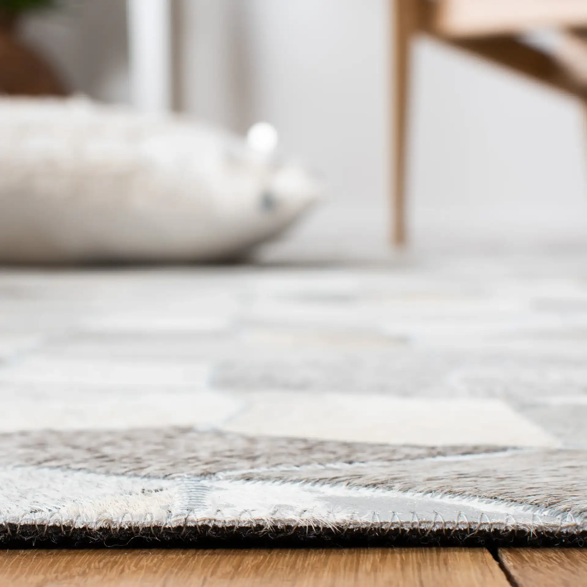 Studio Leather Cube Flatweave Rug in Ivory / Gray in a styled room