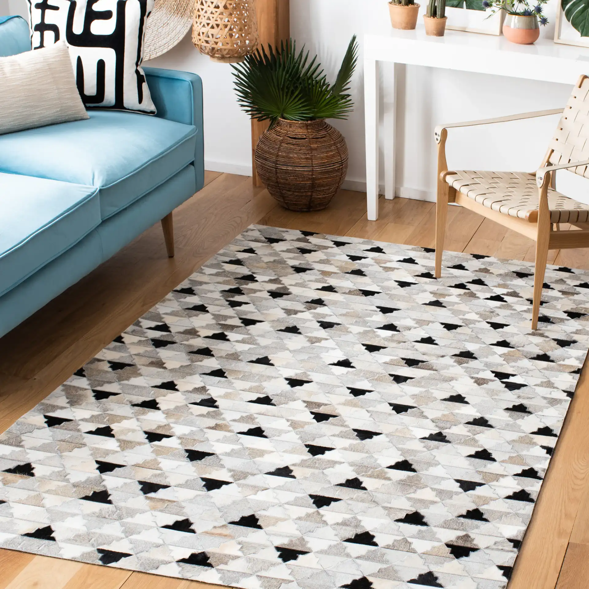 Studio Leather Stepped Triangle Flatweave Rug in Gray / Black in a styled room