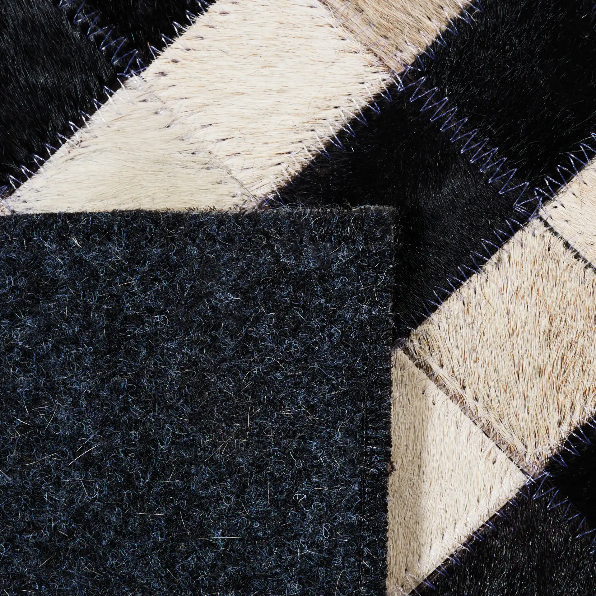 Studio Leather Labyrinth Flatweave Rug in Black / Ivory in a styled room