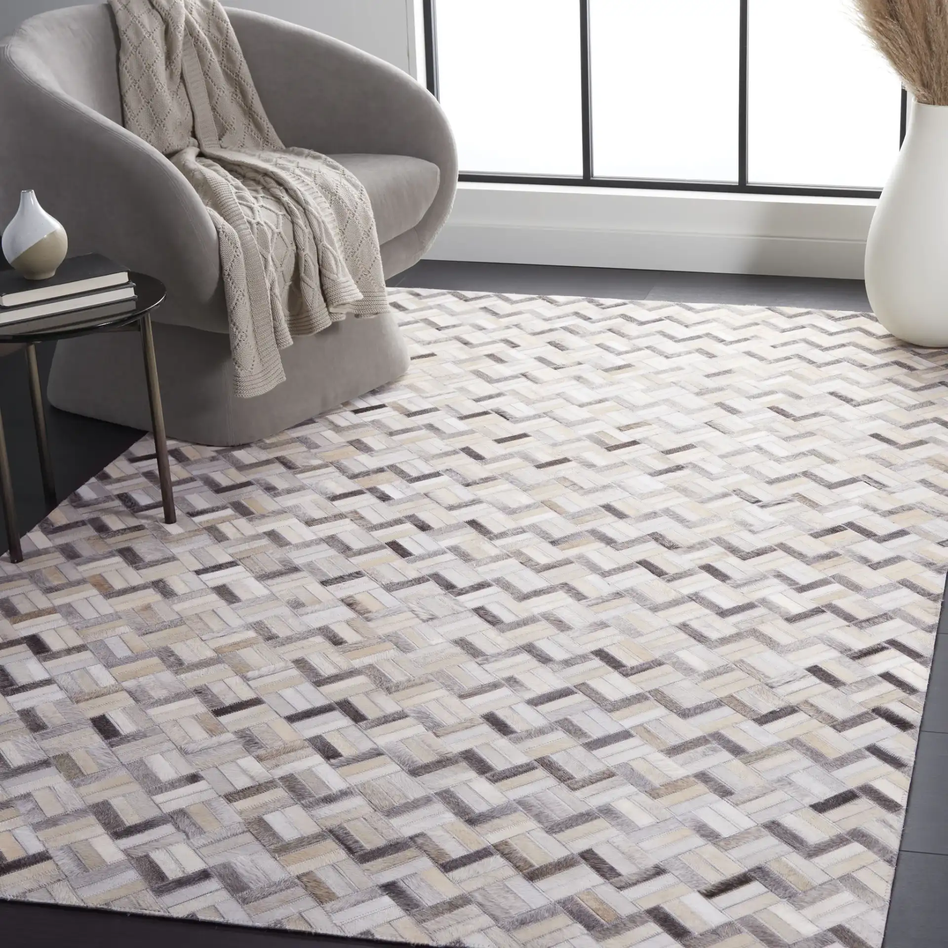 Studio Leather Modern Herringbone Rug in Black / Gray in a styled room