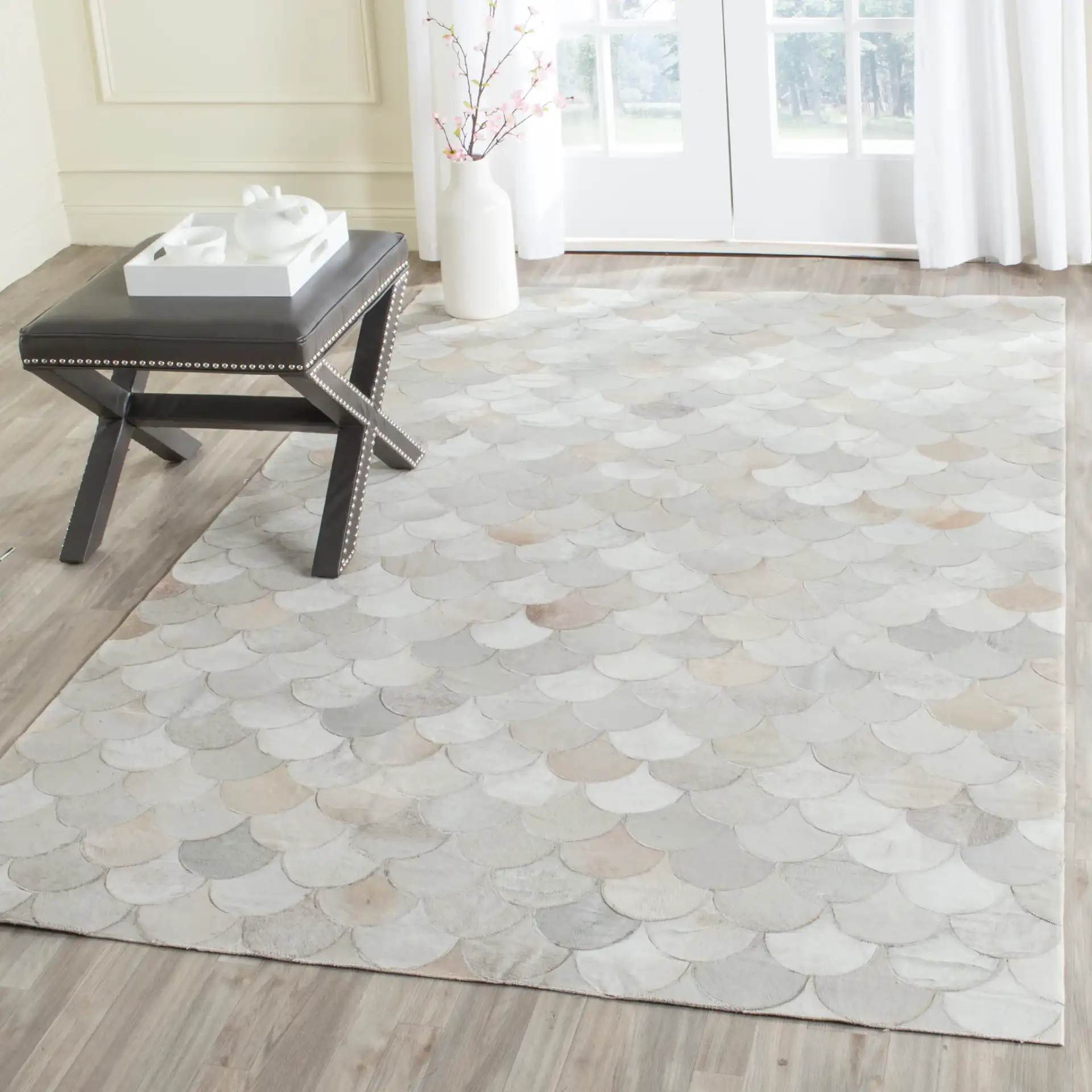 Studio Leather Fish Scale Patchwork Hand-Woven Rug in Ivory / Gray in a styled room