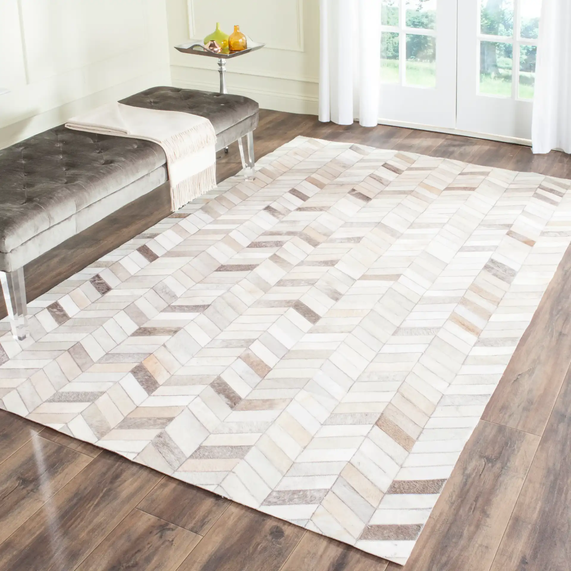 Studio Leather Herringbone Patchwork Hand-Woven Rug in Gray in a styled room