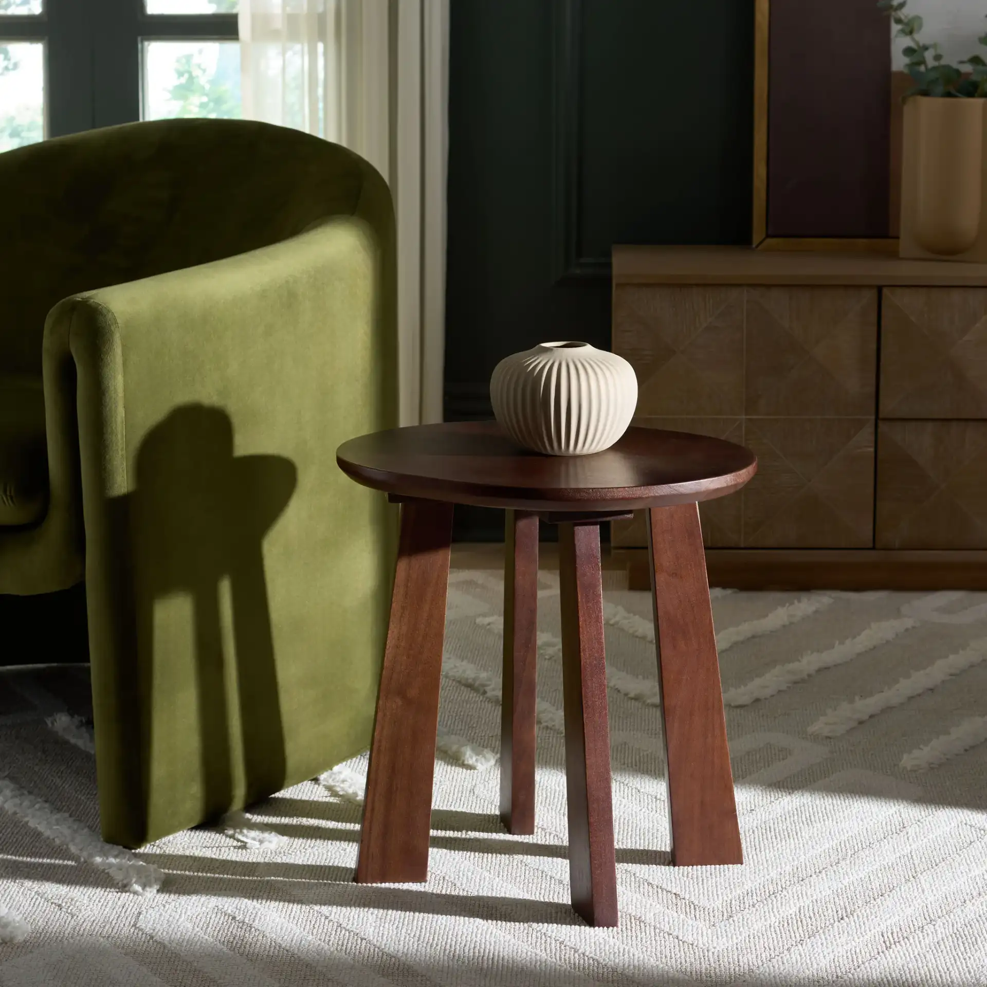 Zoro Round Stool in Brown in a styled room