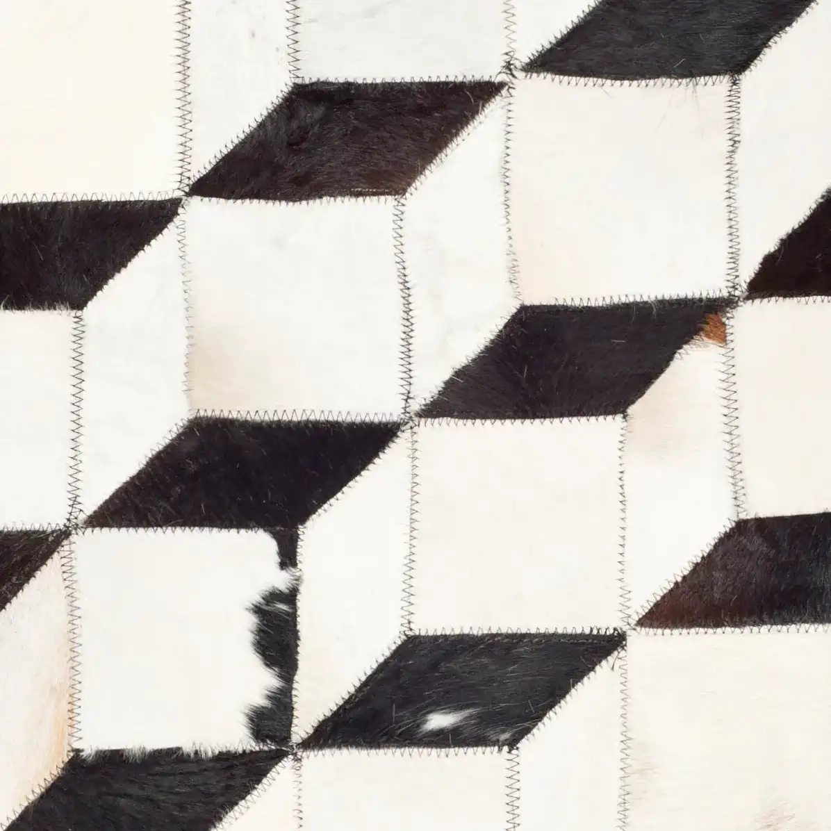 Studio Leather Patchwork Cubes Rug in Black / Gray in a styled room