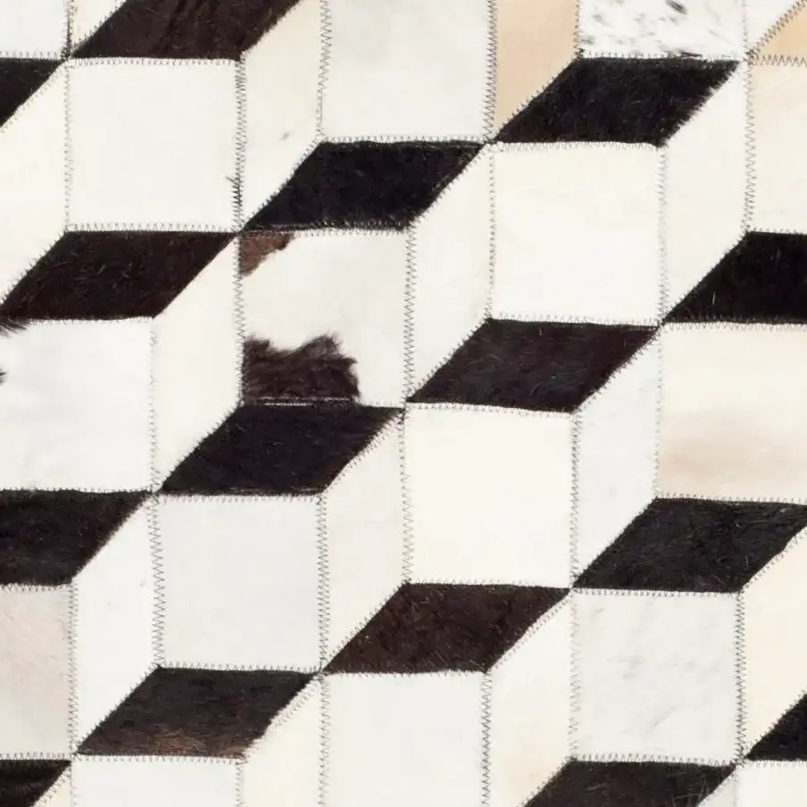 Studio Leather Patchwork Cubes Rug in Black / Gray in a styled room