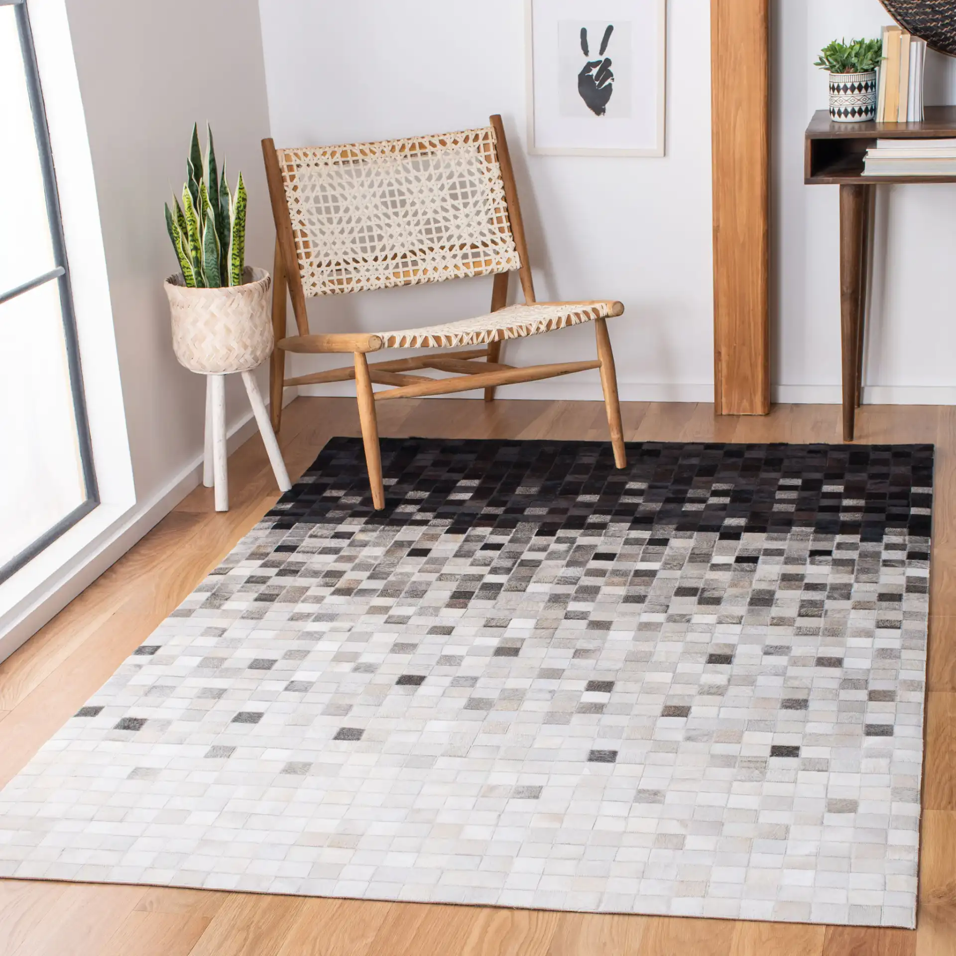 Studio Leather Gradient Grid Hand-Woven Rug in Ivory / Black in a styled room