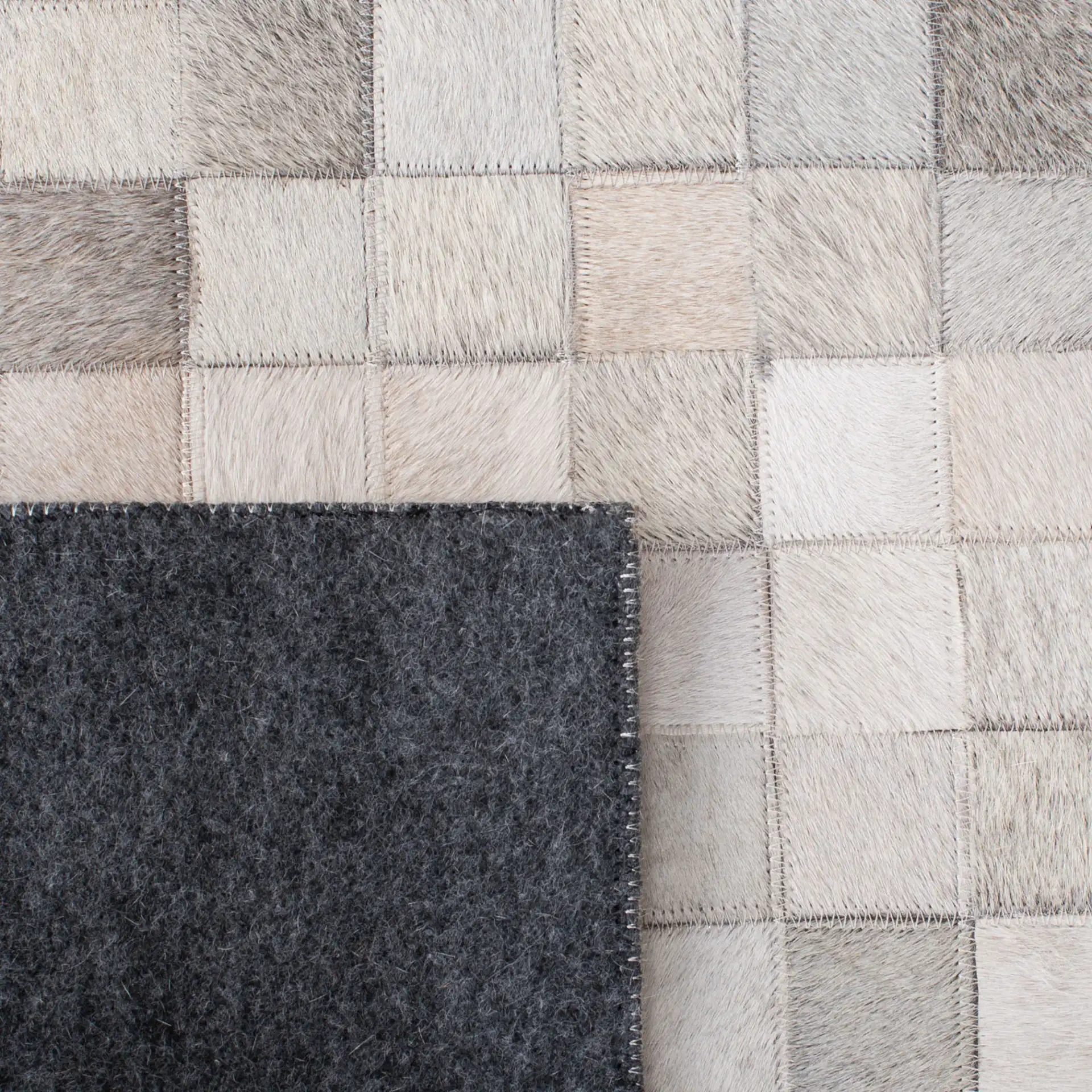 Studio Leather Gradient Grid Hand-Woven Rug in Ivory / Black in a styled room