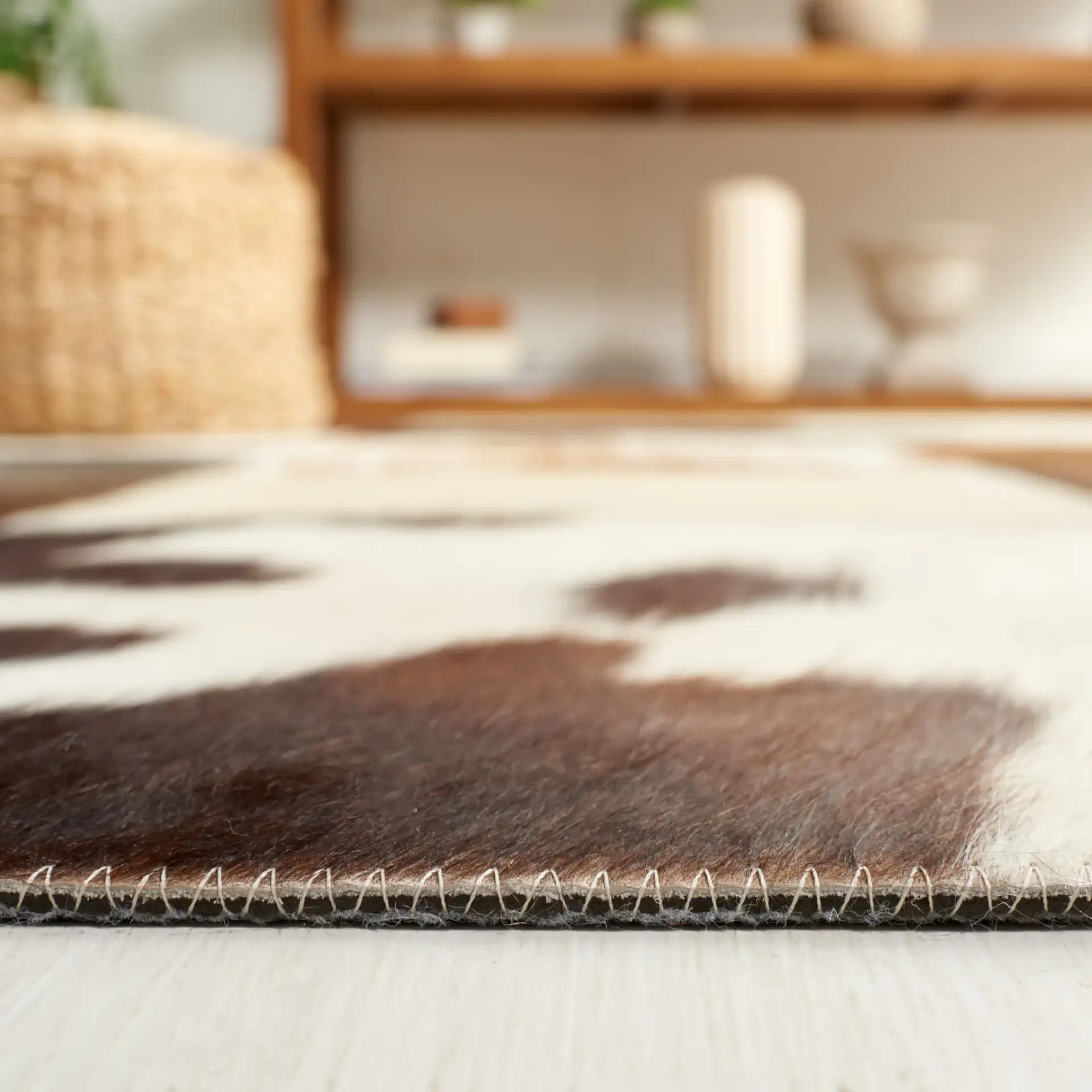 Studio Leather Rustic Block Patchwork Hand-Woven Rug in Brown / Ivory in a styled room
