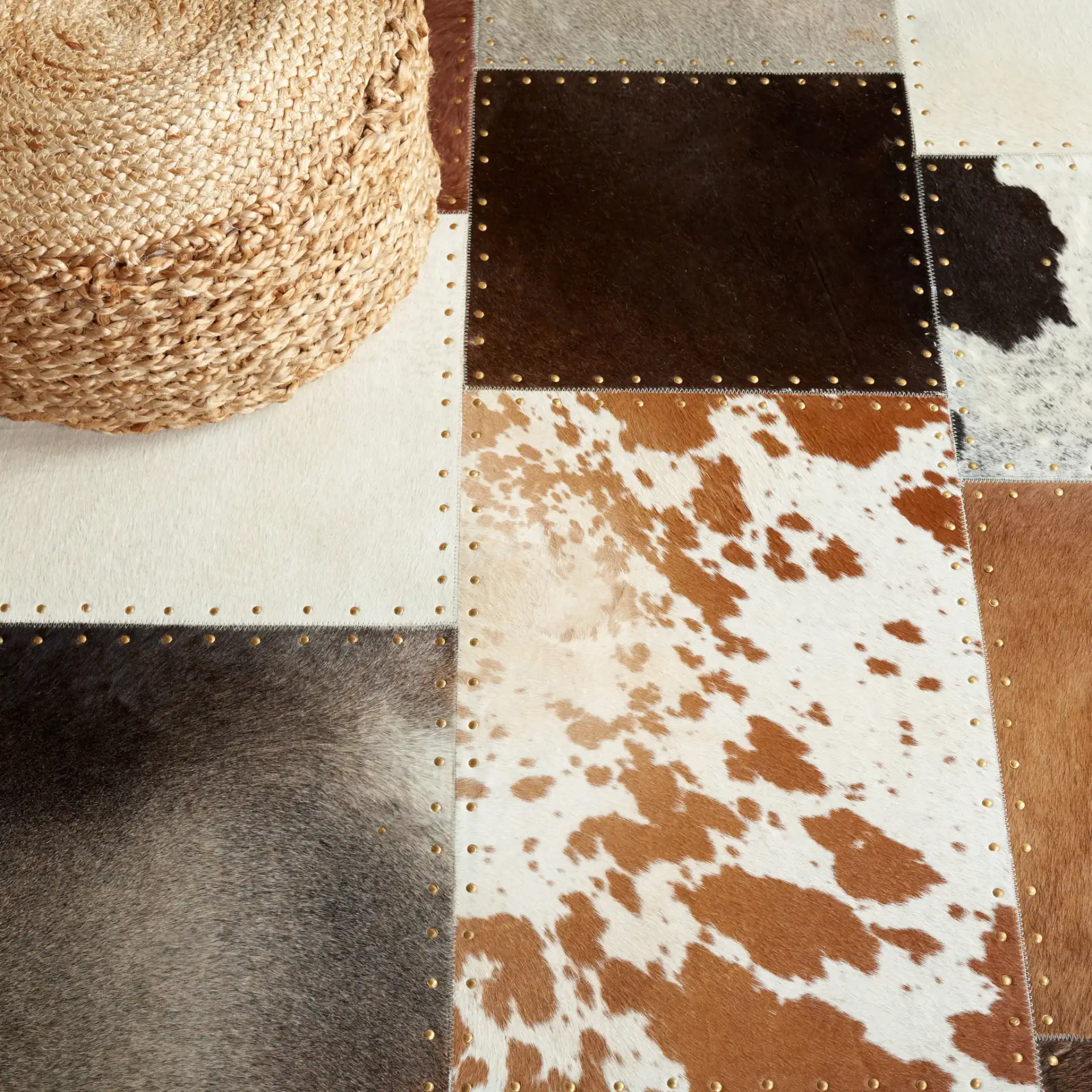 Studio Leather Rustic Block Patchwork Hand-Woven Rug in Brown / Ivory in a styled room
