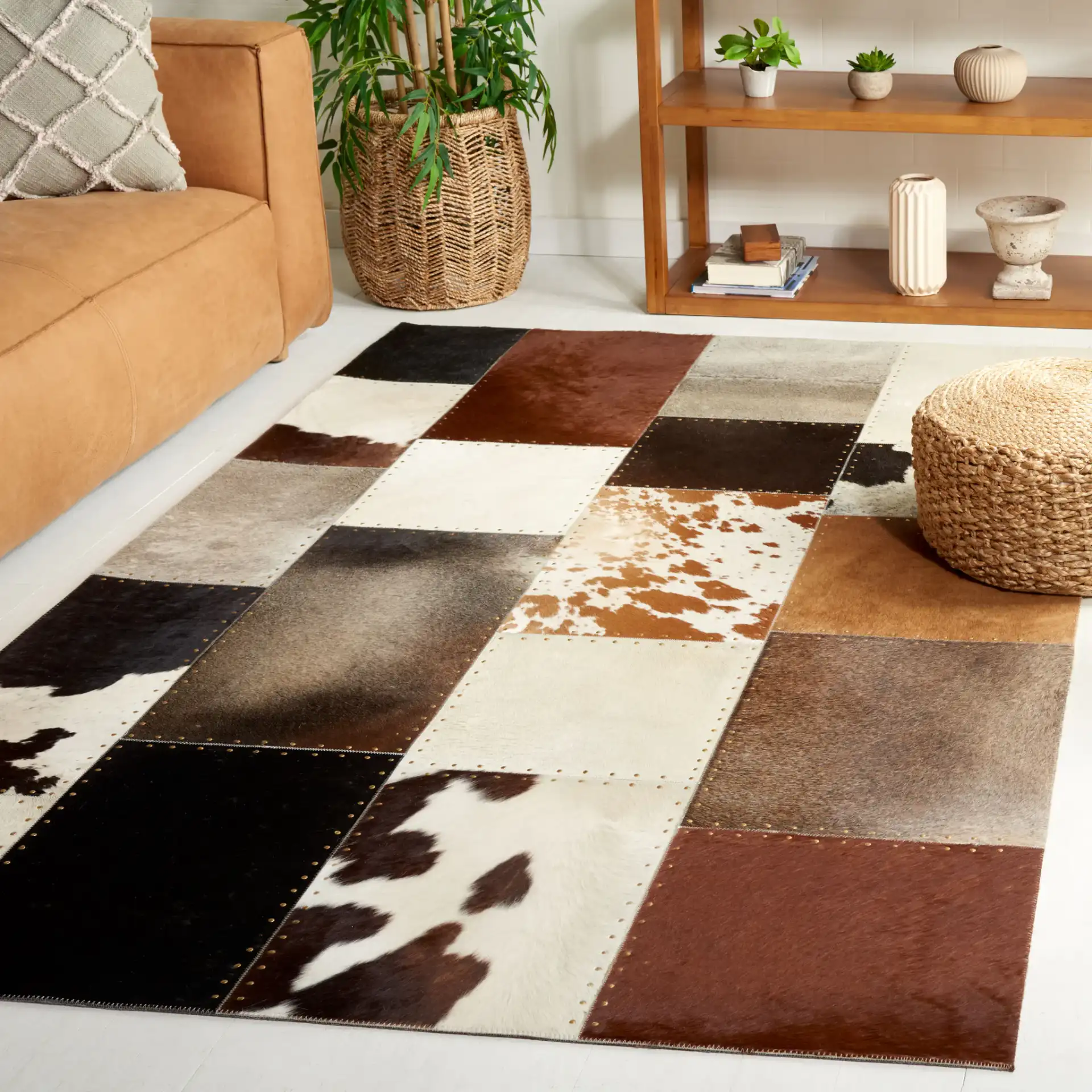 Studio Leather Rustic Block Patchwork Hand-Woven Rug in Brown / Ivory in a styled room