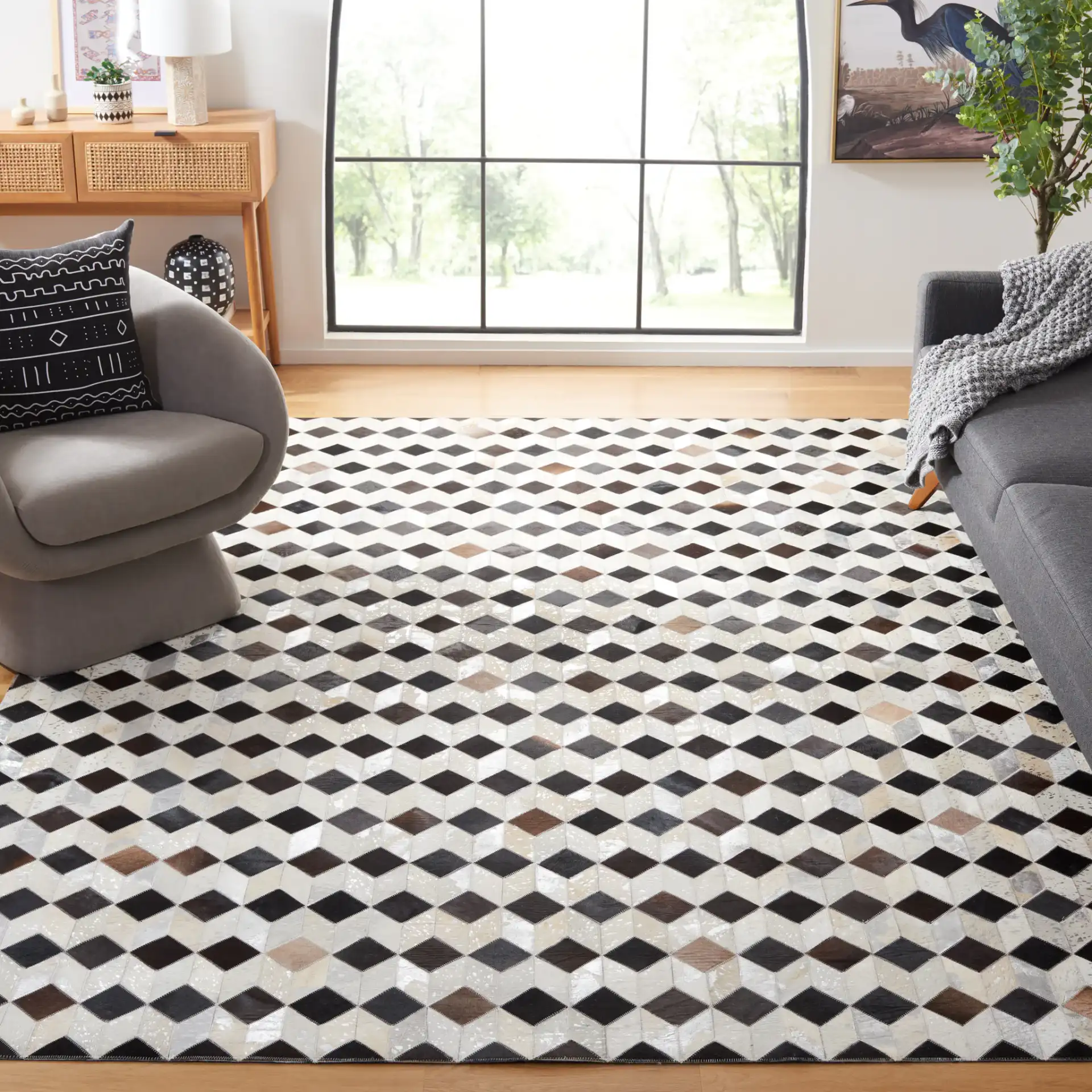 Studio Leather Cube Patchwork Hand-Woven Rug in Beige / Black in a styled room