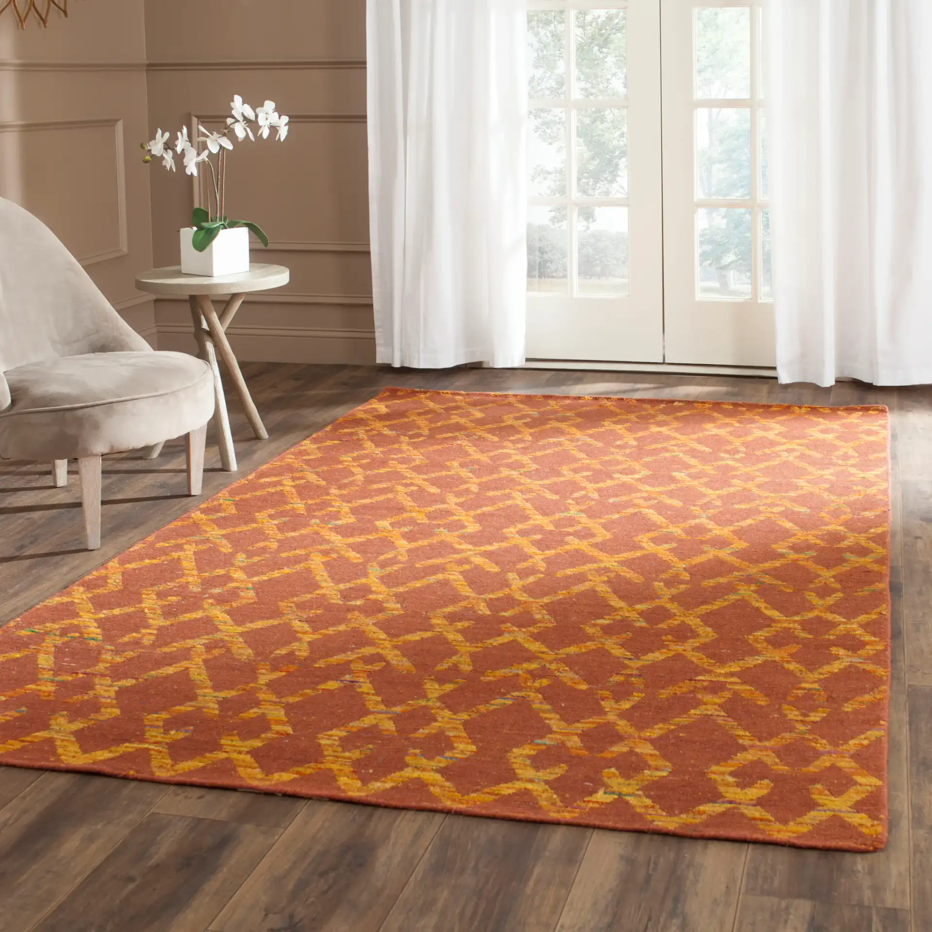 Straw Patch Interlocking Diamond Hand-Woven Rug in Rust / Gold in a styled room