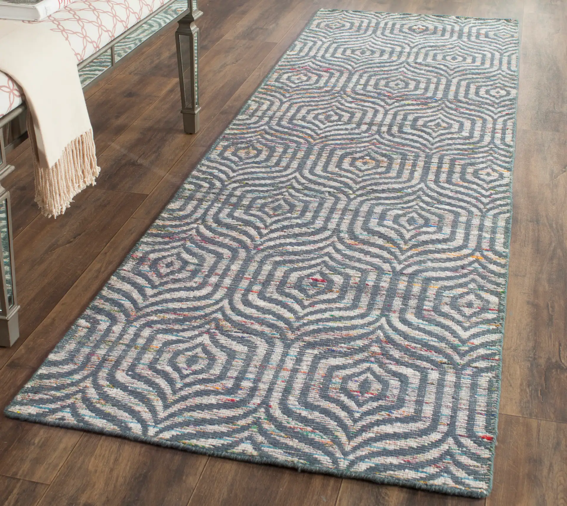 Straw Patch Interlocking Wave Hand-Woven Wool Rug in Blue / Multicolor in a styled room