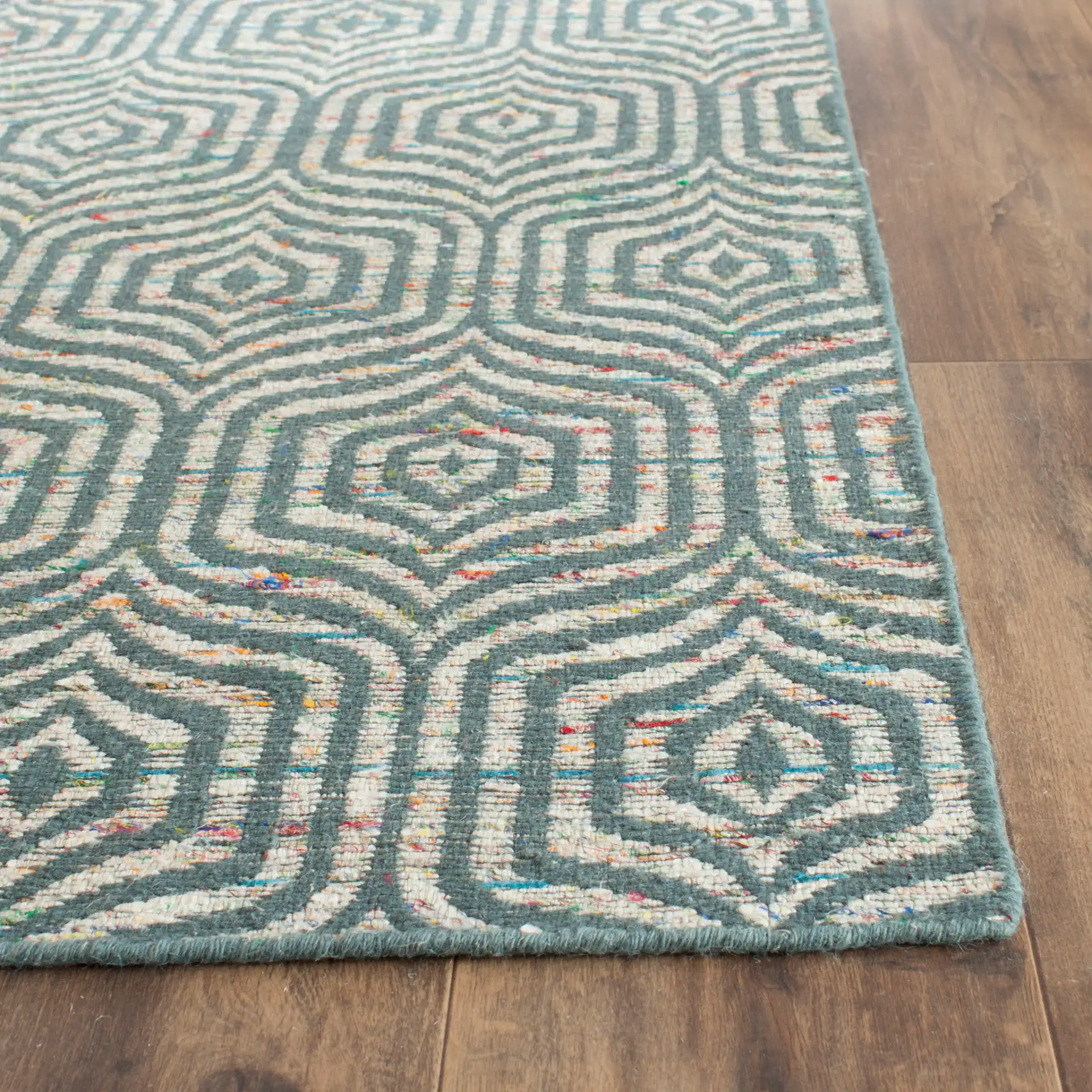 Straw Patch Interlocking Wave Hand-Woven Wool Rug in Blue / Multicolor in a styled room