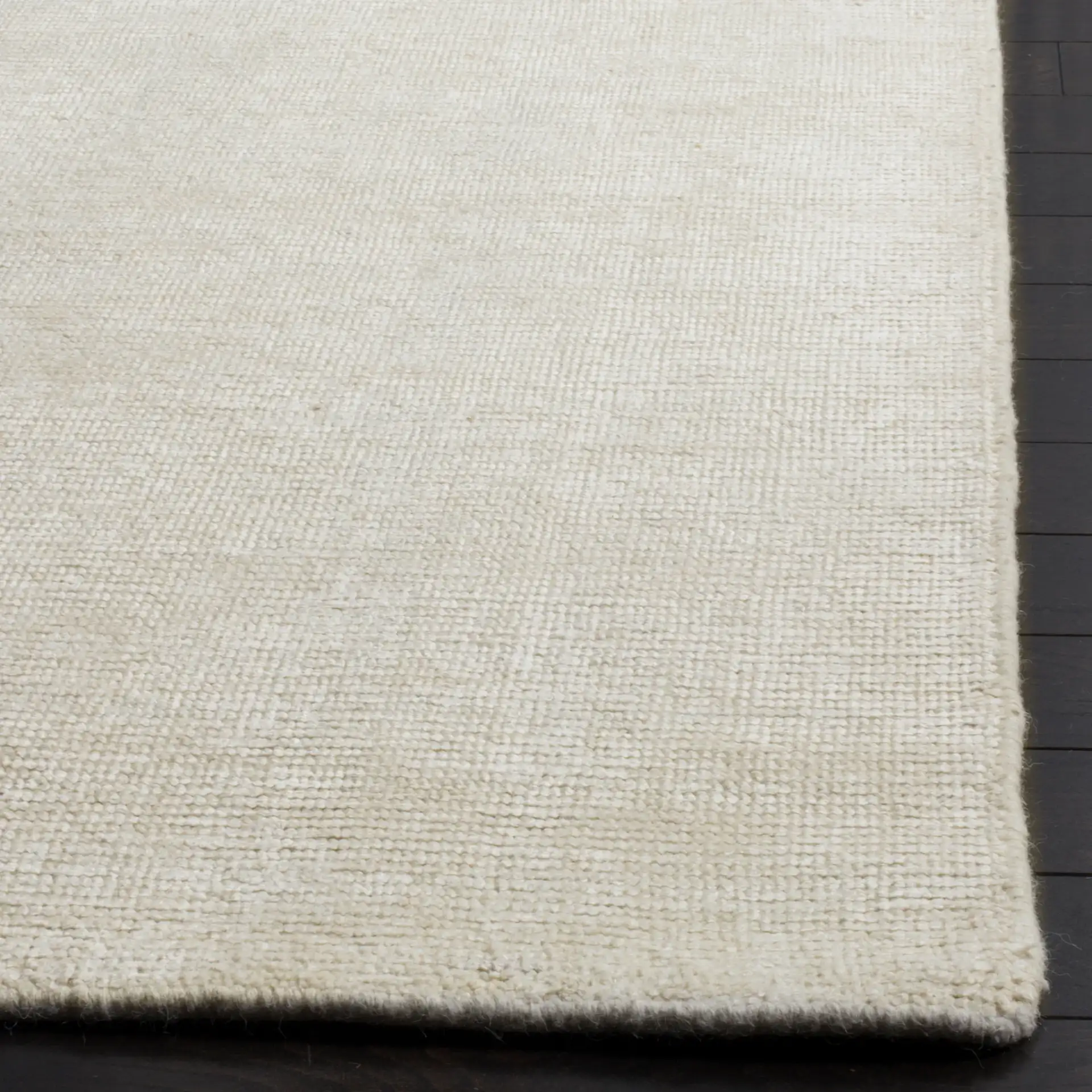 Stone Wash Textured Solid Hand-Knotted Rug in Ivory in a styled room