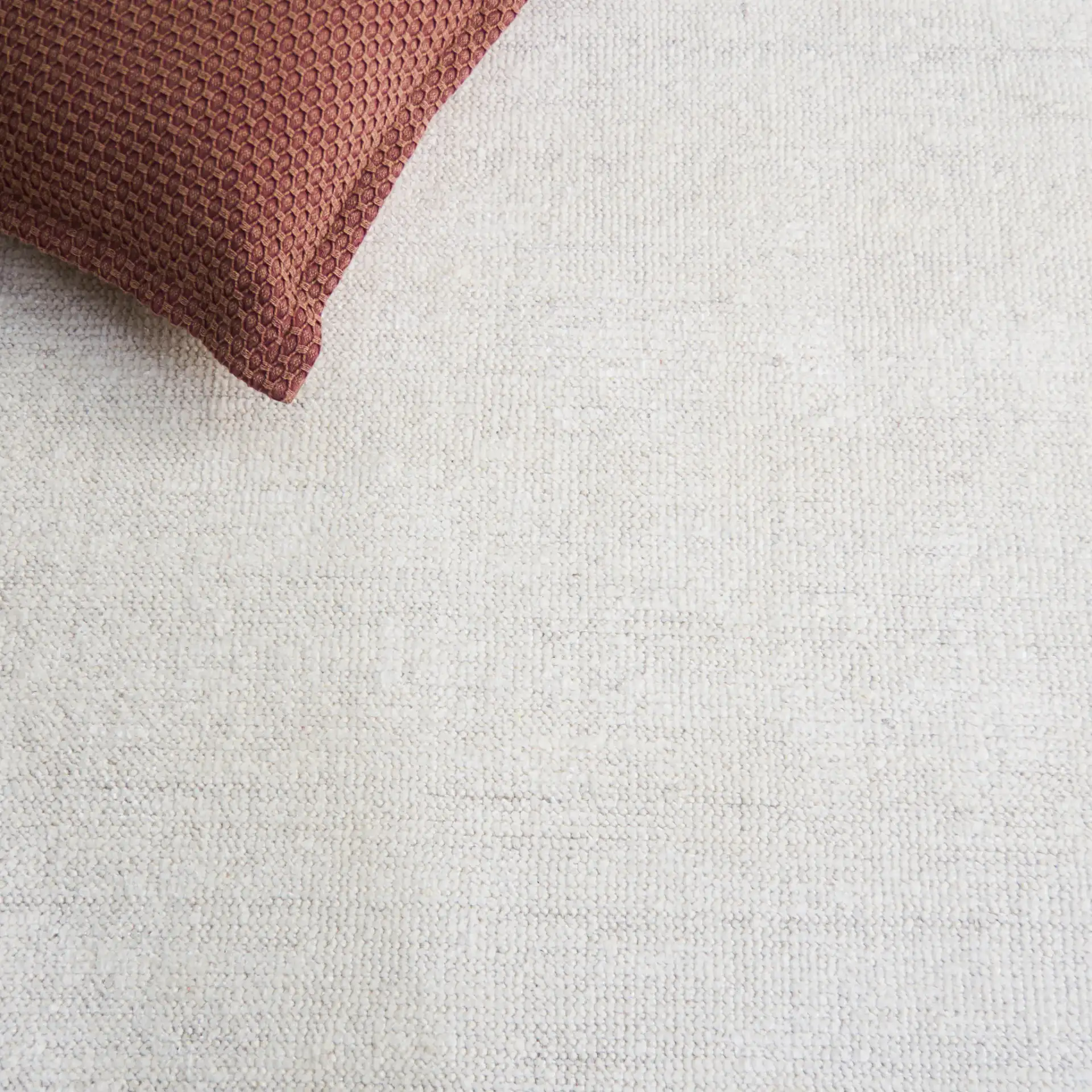 Stone Wash Textured Solid Hand-Knotted Rug in Ivory in a styled room