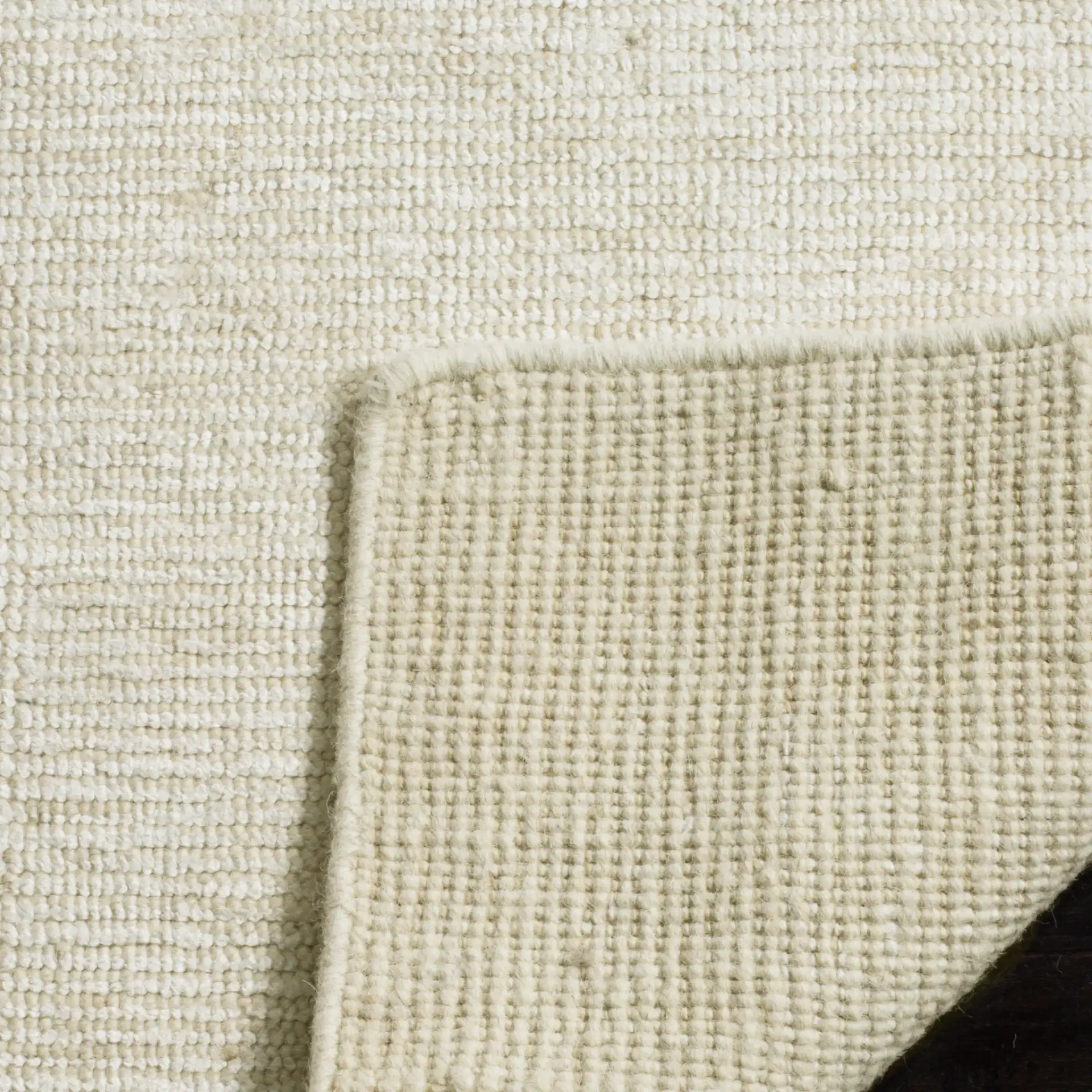 Stone Wash Textured Solid Hand-Knotted Rug in Ivory in a styled room