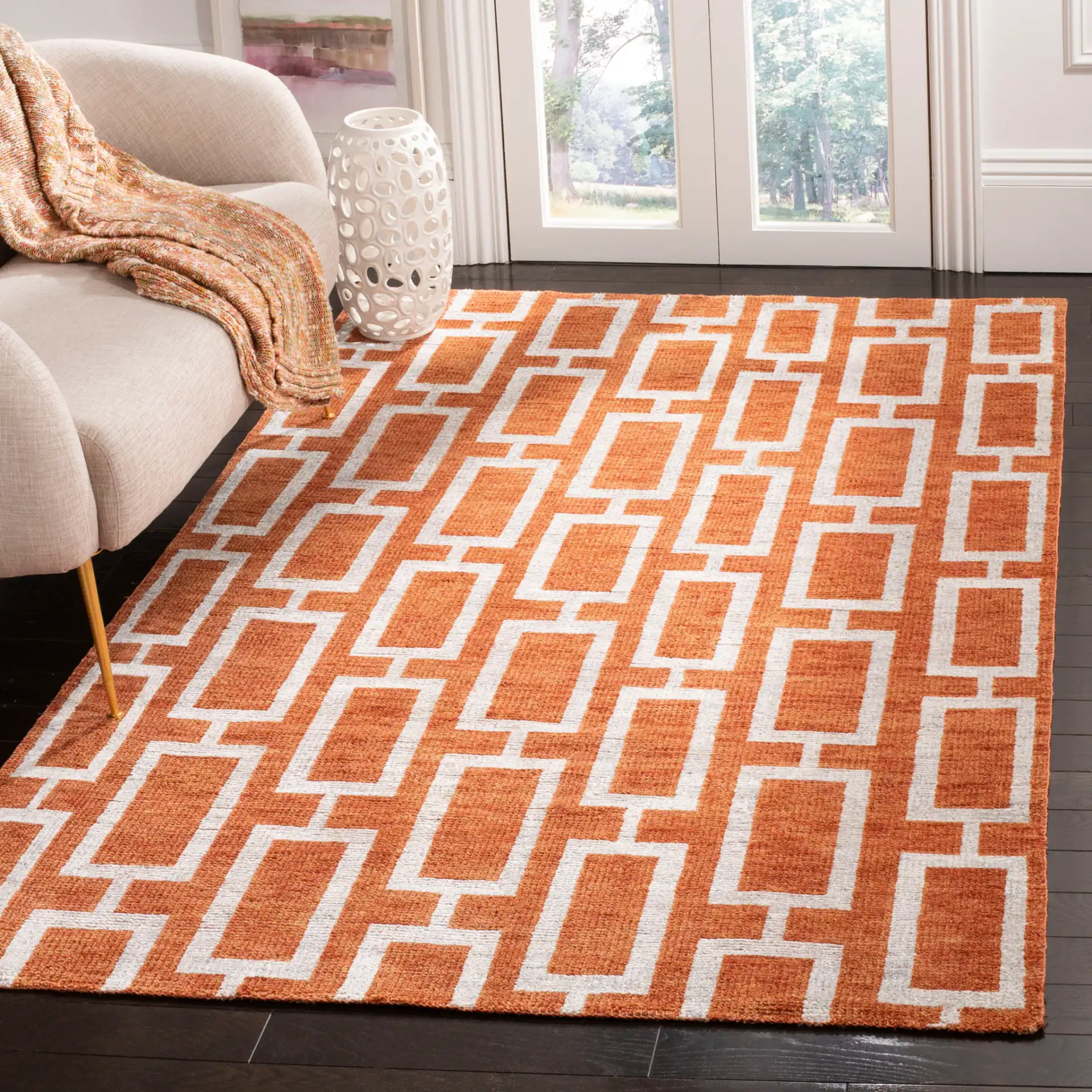 Stone Wash Interlocking Rectangles Hand-Knotted Rug in Rust in a styled room