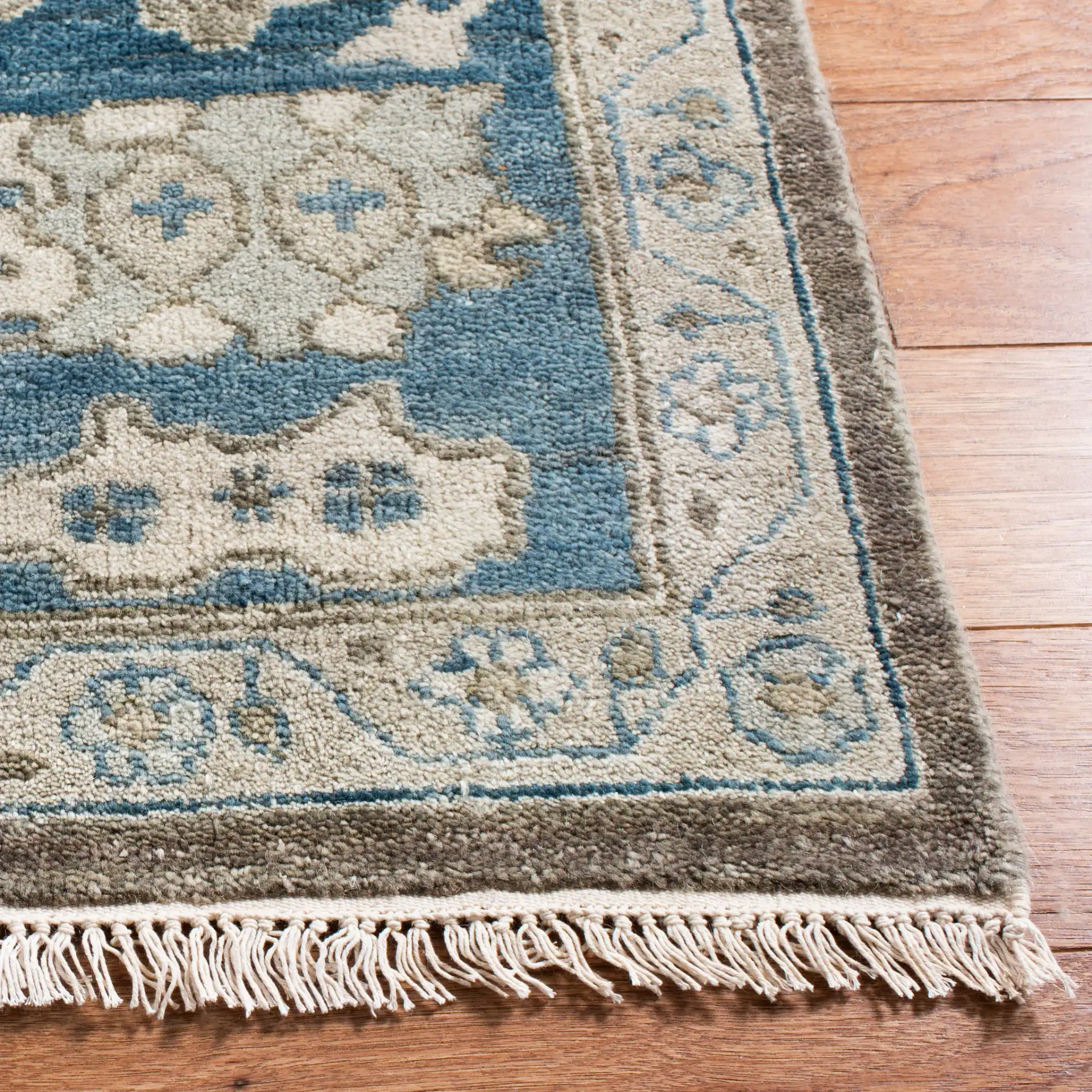 Sultanabad Floral Bordered Hand-Knotted Wool Rug in Blue in a styled room
