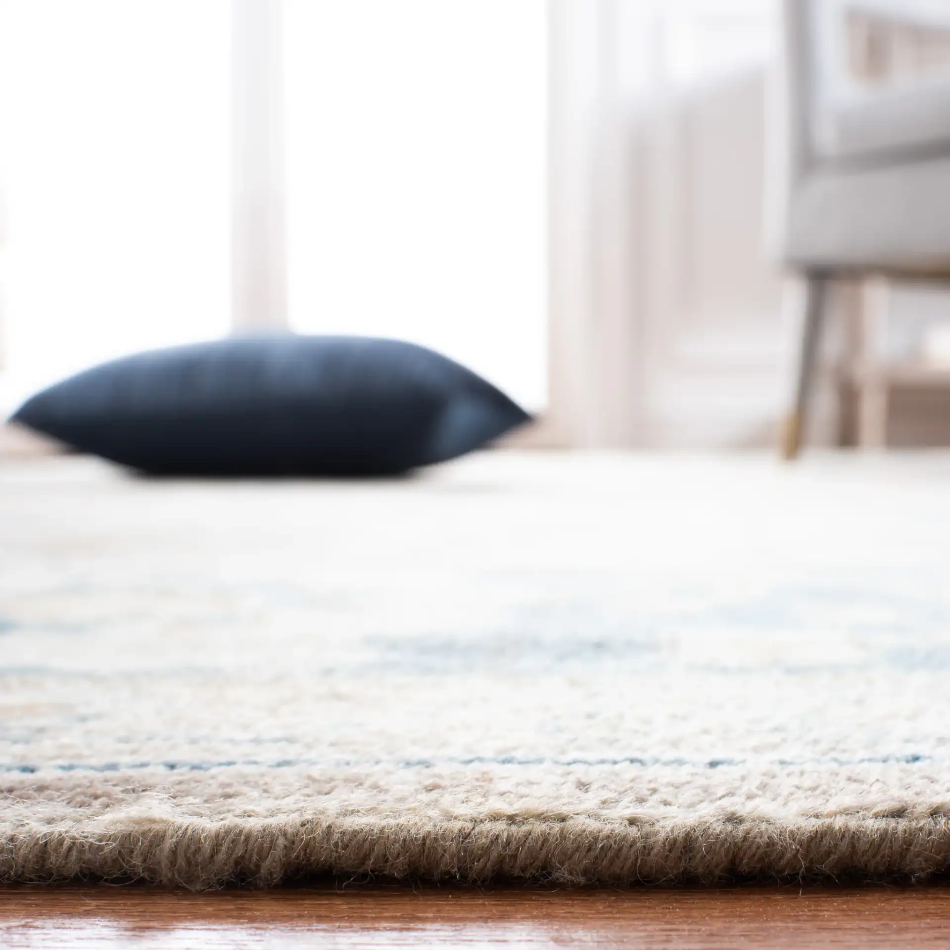 Sultanabad Floral Bordered Hand-Knotted Wool Rug in Blue in a styled room
