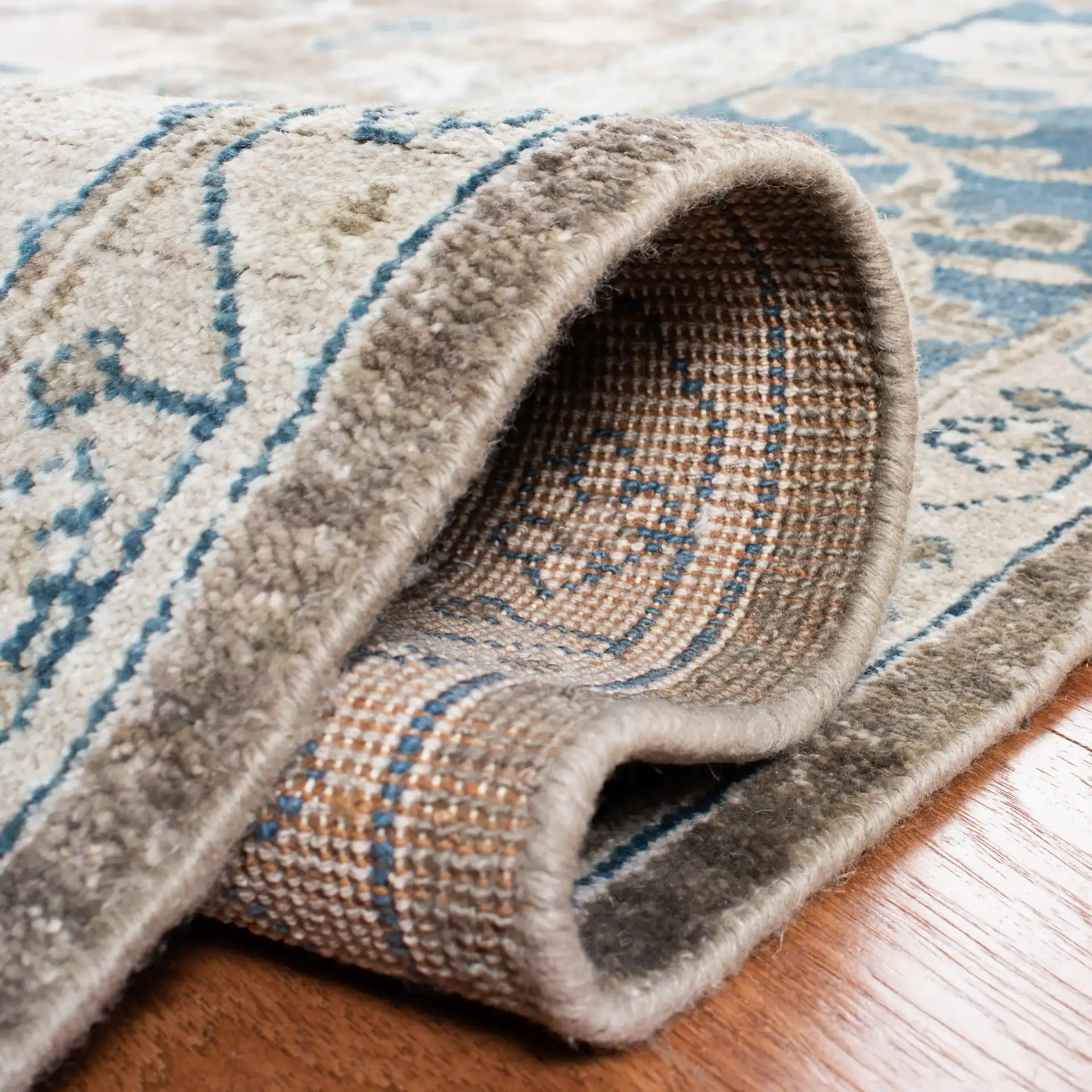Sultanabad Floral Bordered Hand-Knotted Wool Rug in Blue in a styled room