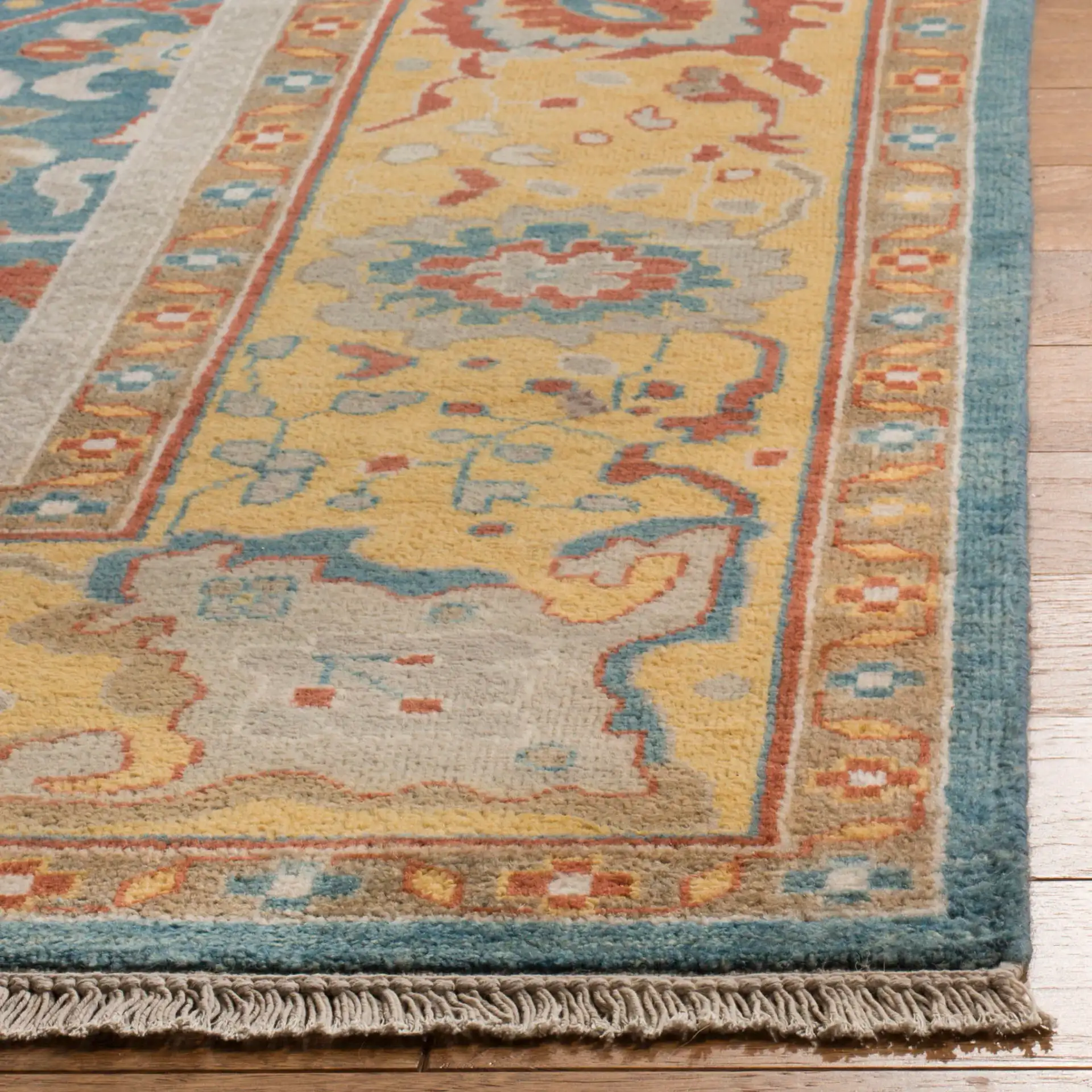 Sultanabad Floral Hand-Knotted Wool Rug in Blue / Gold in a styled room