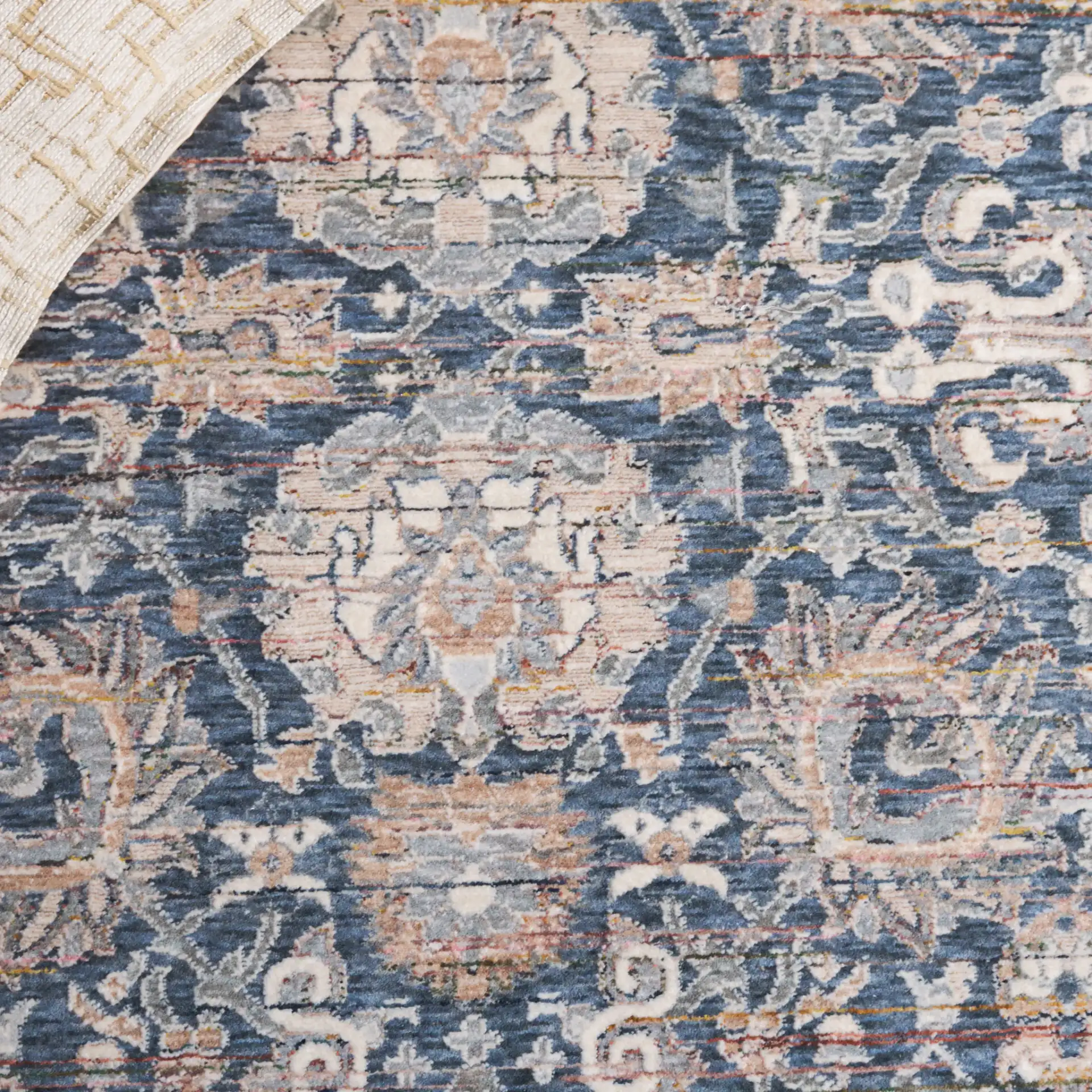 Sutton Distressed Floral Rug in Navy / Beige Brown in a styled room