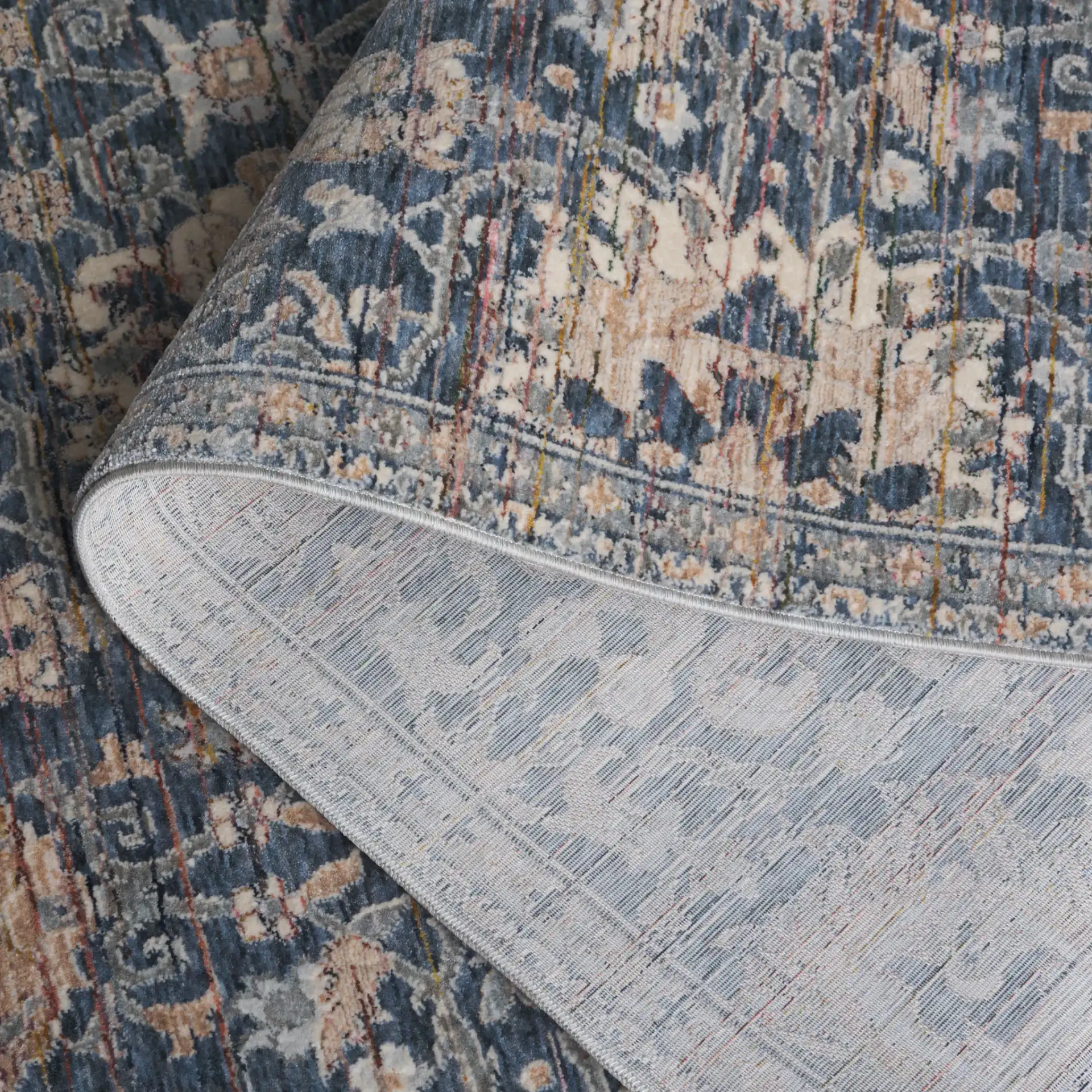 Sutton Distressed Floral Rug in Navy / Beige Brown in a styled room