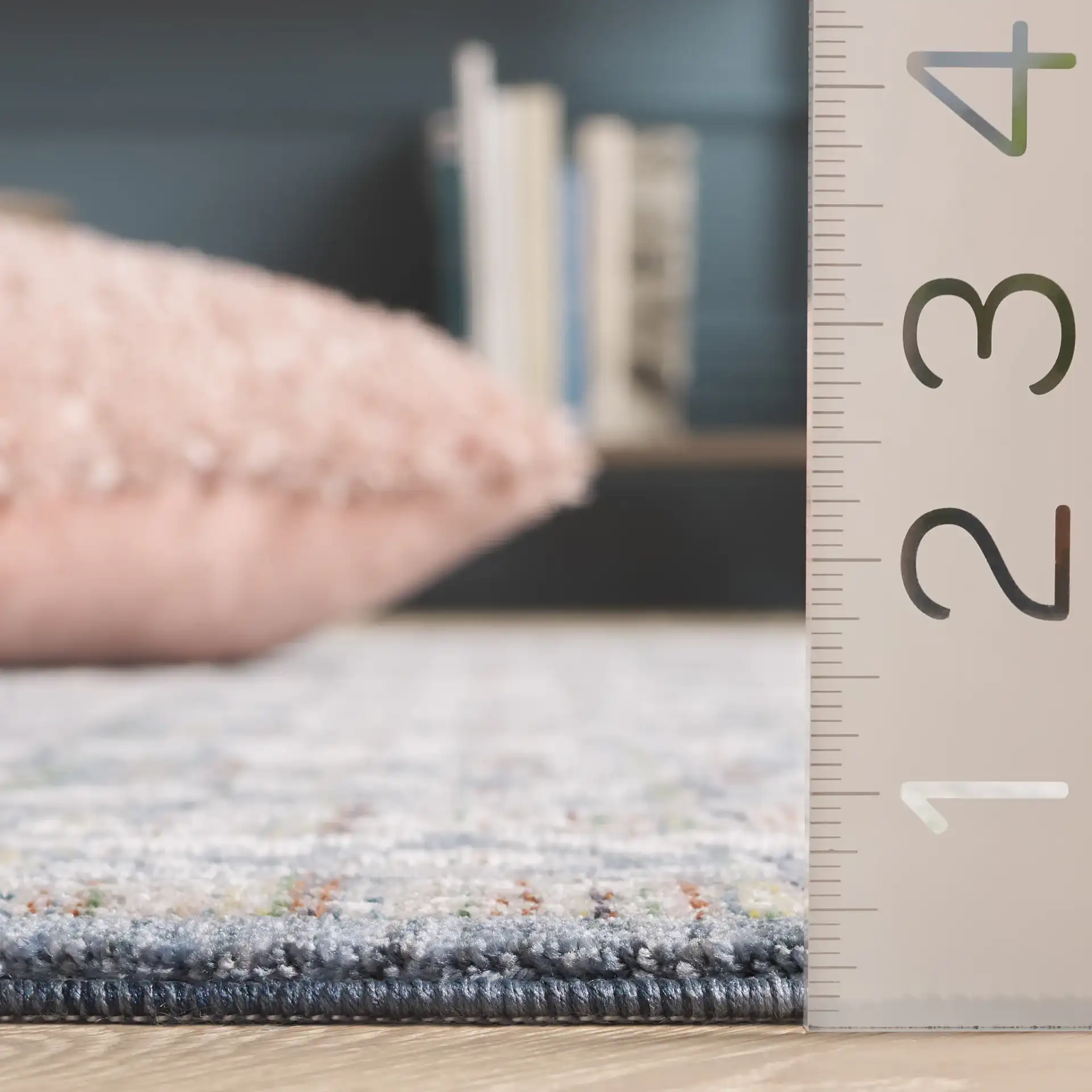 Sutton Bordered Floral Rug in Navy / Beige in a styled room