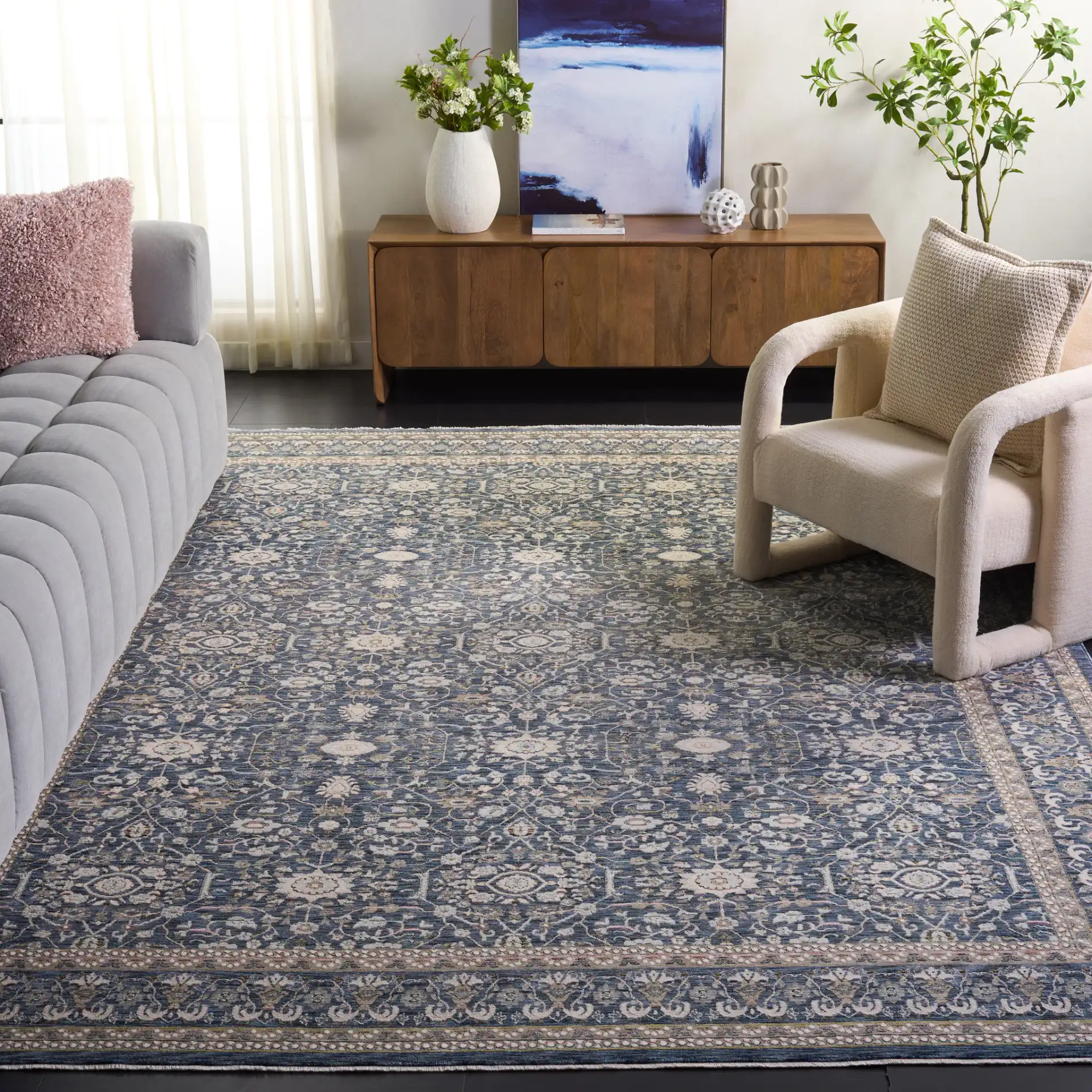 Sutton Bordered Floral Rug in Navy / Beige in a styled room