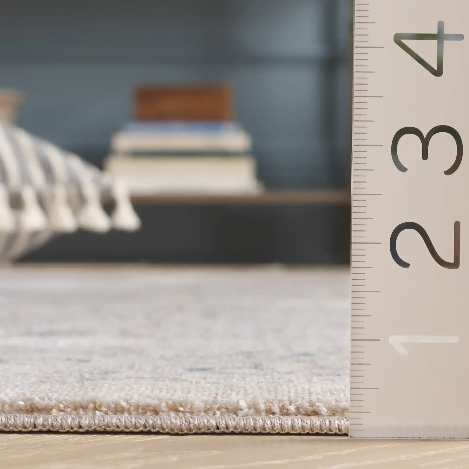 Sutton Floral Bordered Rug in Beige / Navy in a styled room