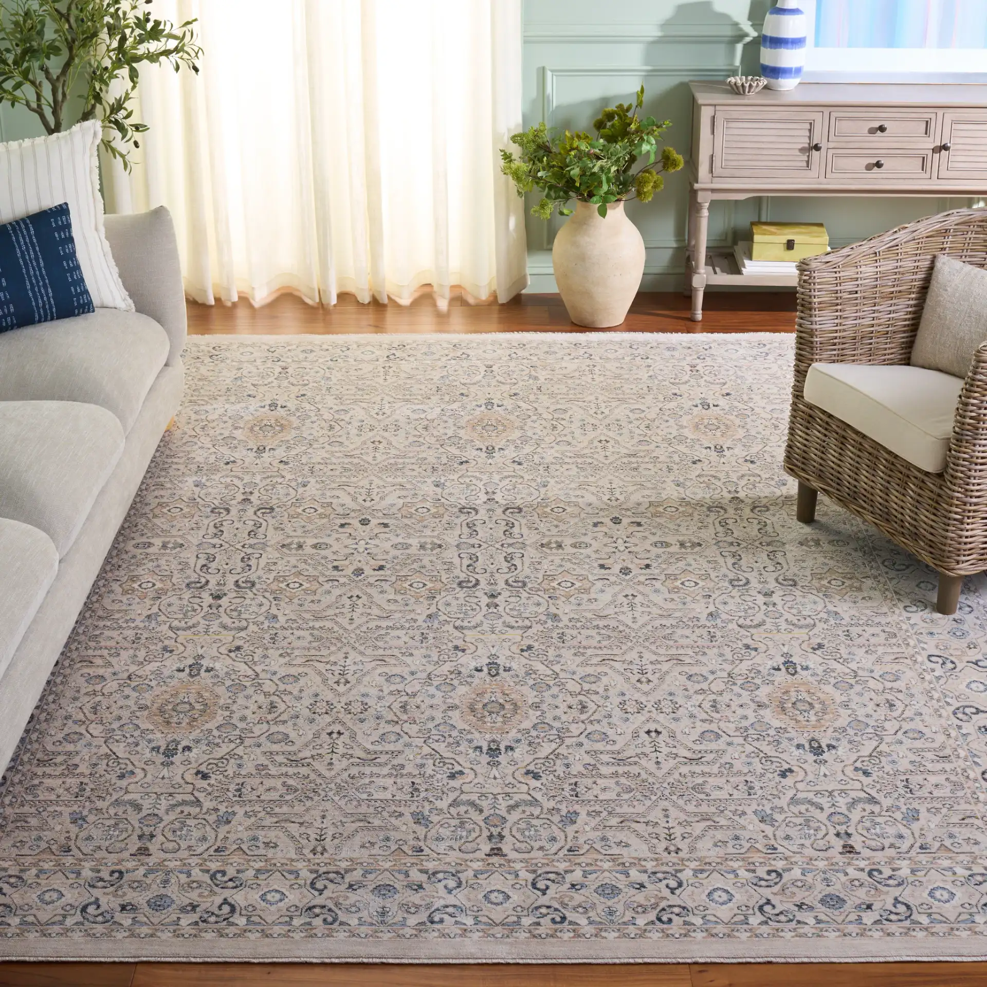 Sutton Floral Bordered Rug in Beige / Navy in a styled room