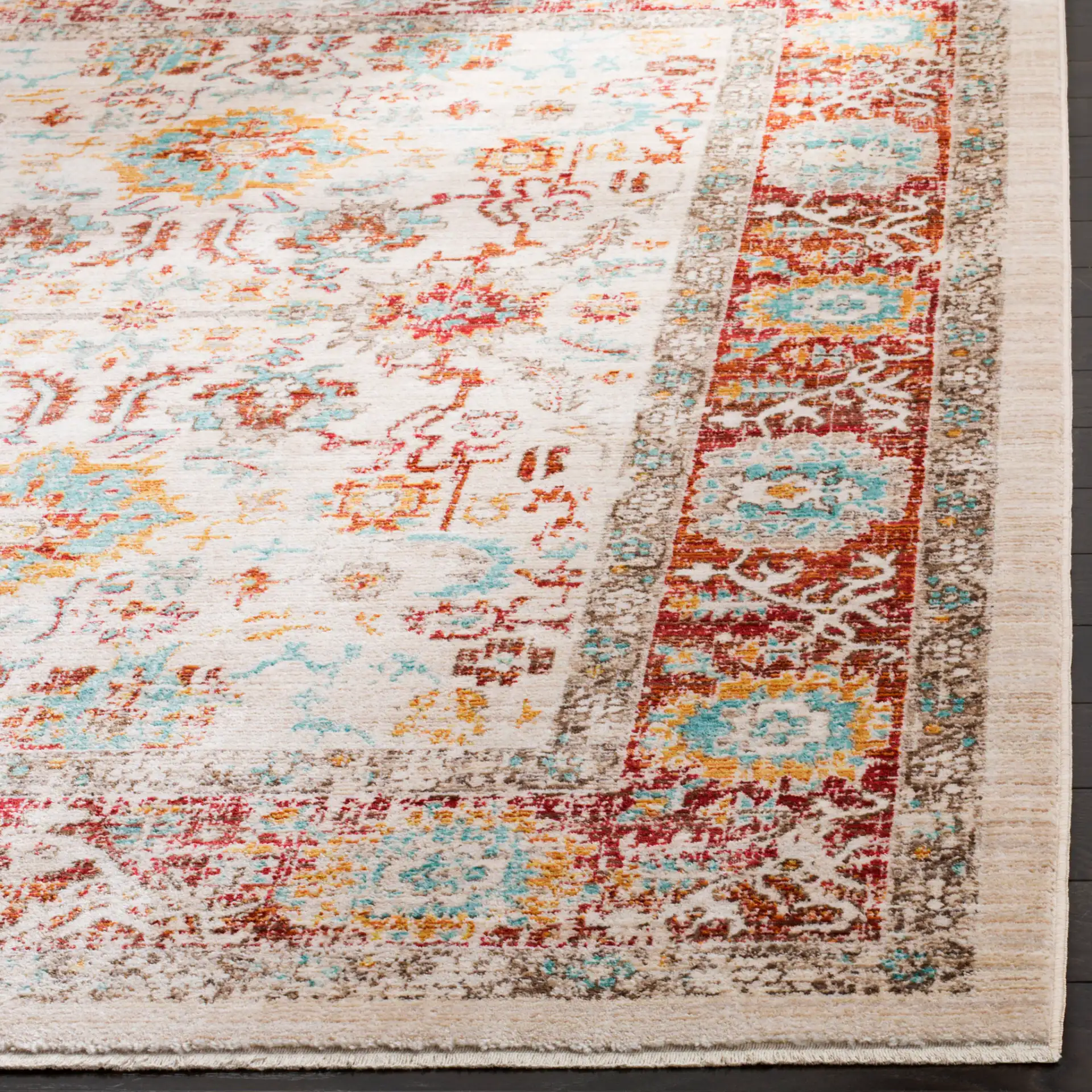 Sutton Distressed Medallion Bordered Rug in Ivory / Brick Red in a styled room