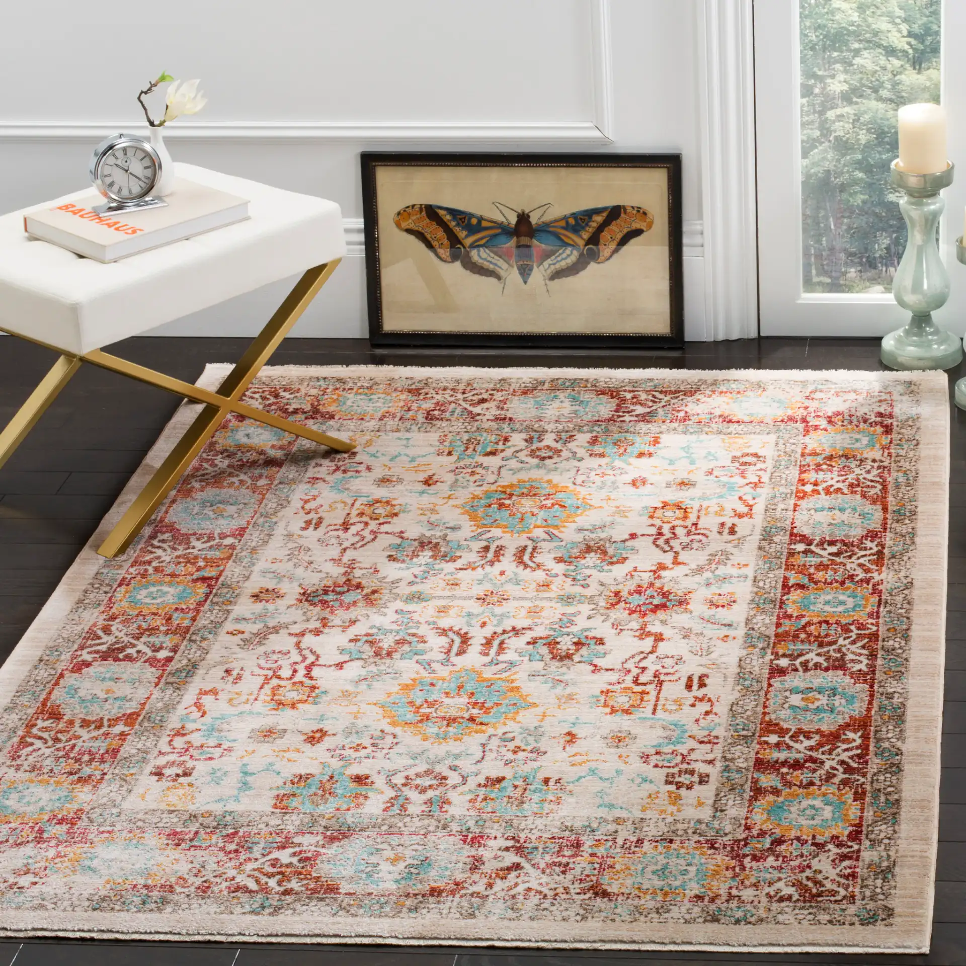 Sutton Distressed Medallion Bordered Rug in Ivory / Brick Red in a styled room