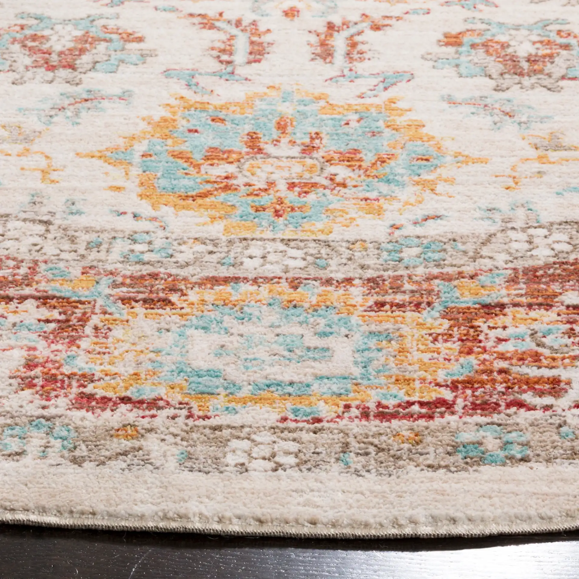Sutton Distressed Medallion Bordered Rug in Ivory / Brick Red in a styled room