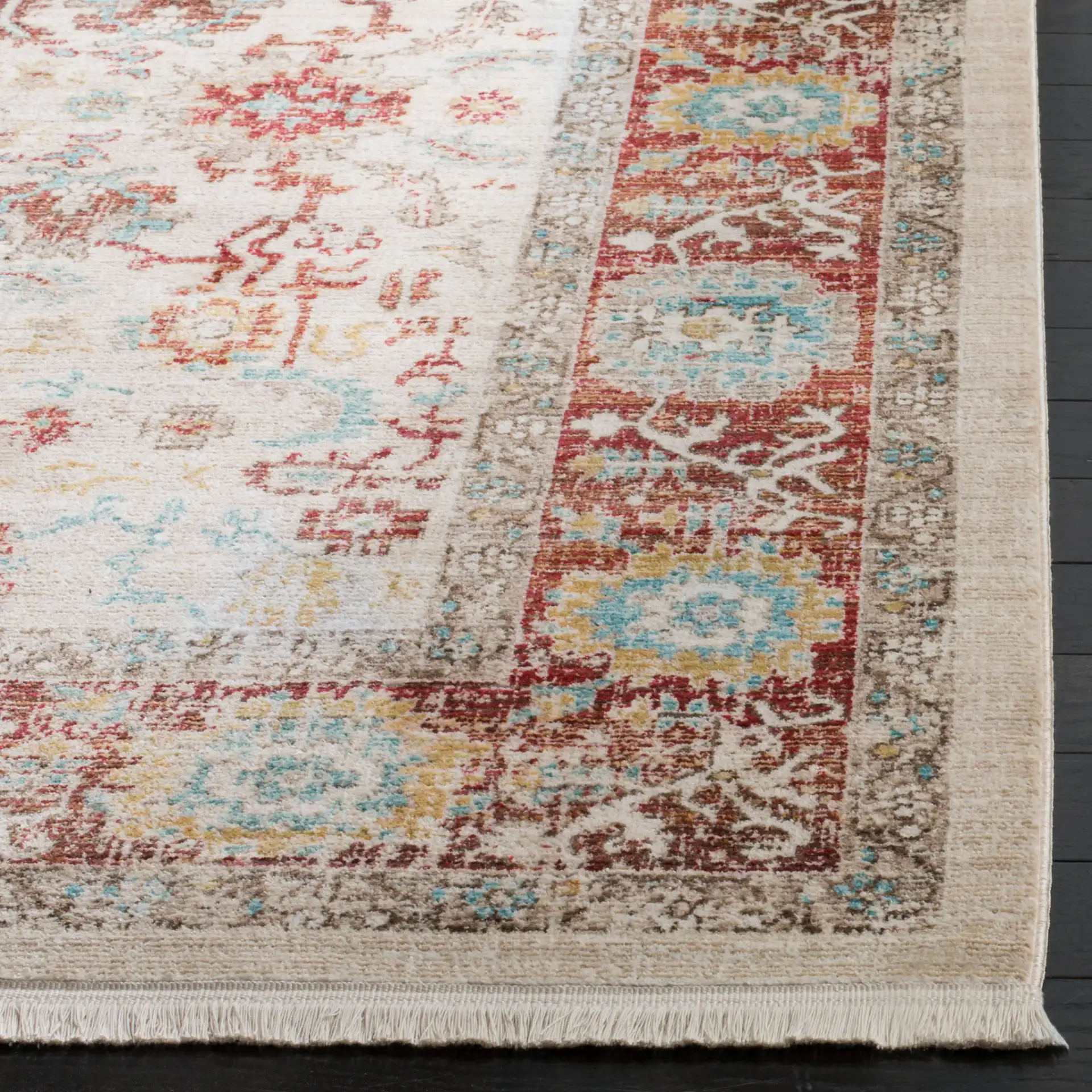 Sutton Distressed Medallion Bordered Rug in Ivory / Brick Red in a styled room