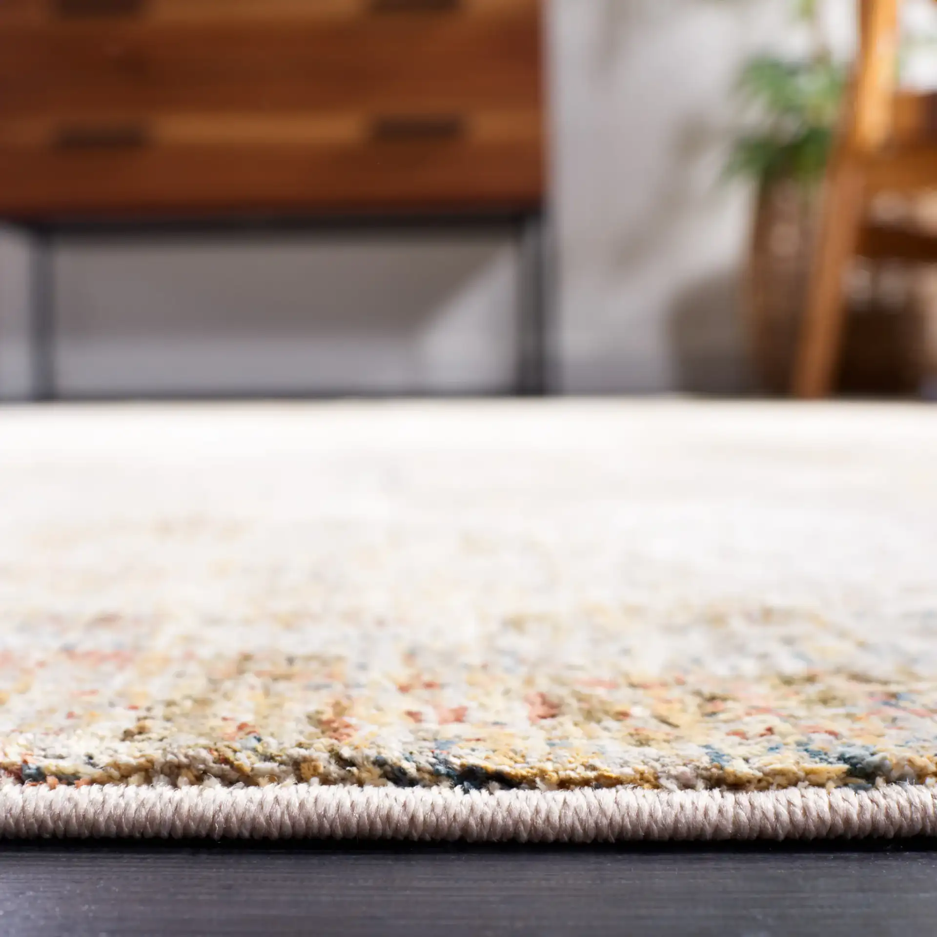 Silverado Abstract Rug in Ivory / Gold in a styled room