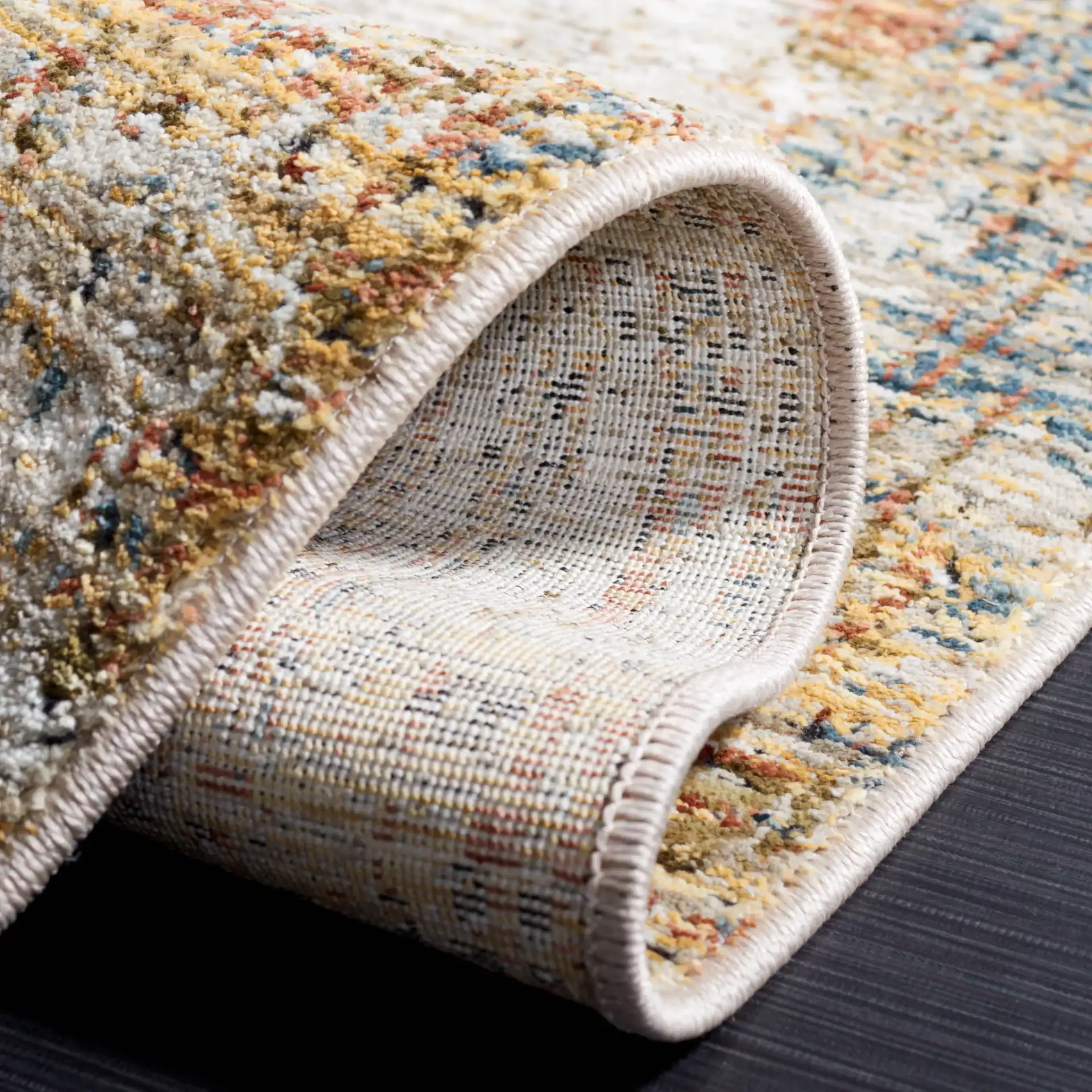Silverado Abstract Rug in Ivory / Gold in a styled room