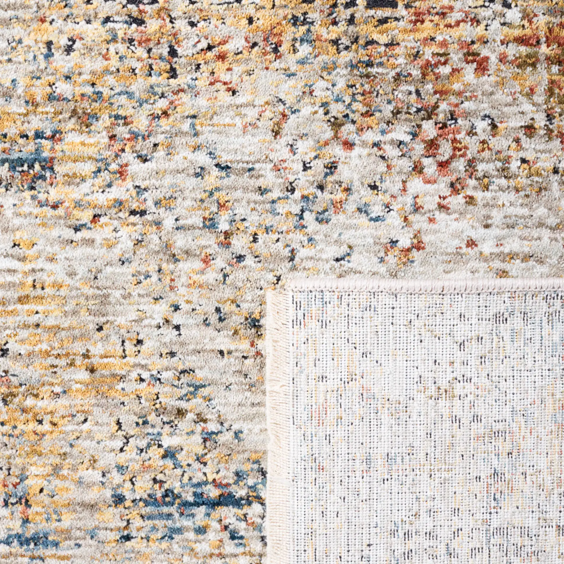 Silverado Abstract Rug in Ivory / Gold in a styled room