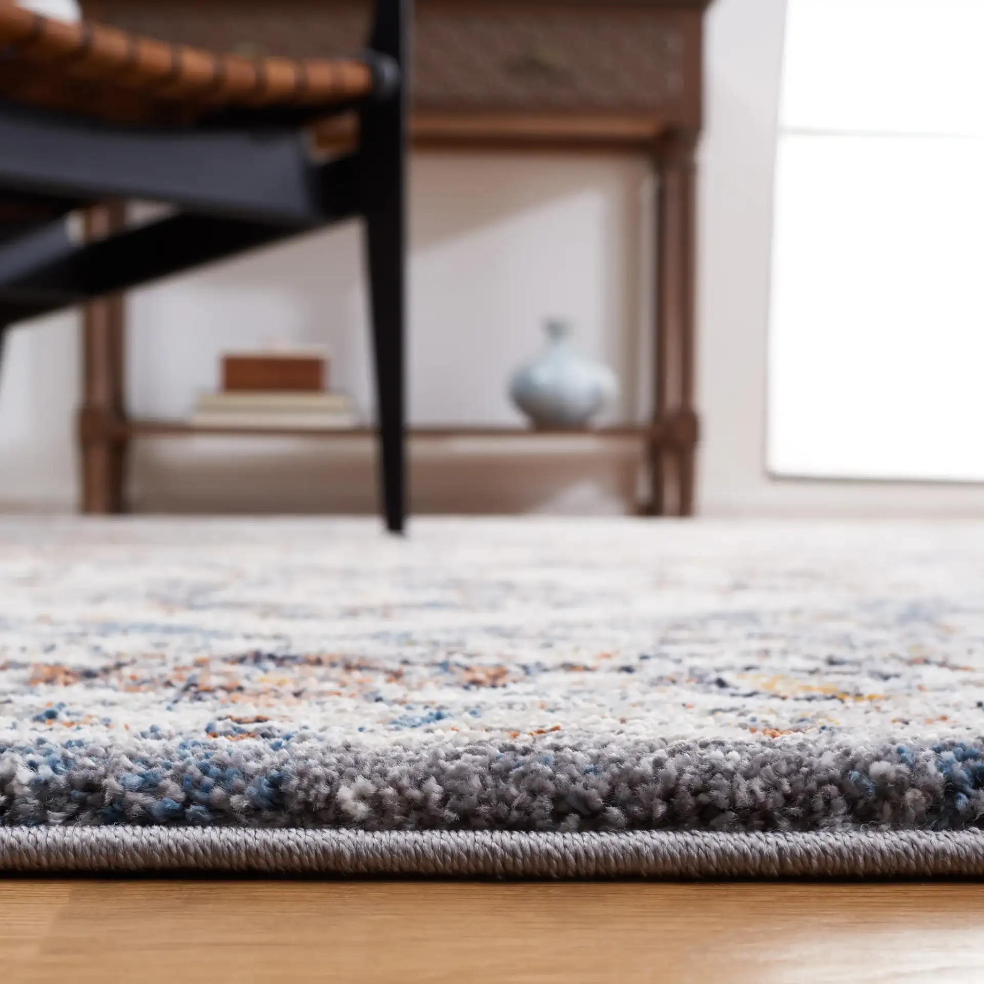 Symphony Medallion Bordered Rug in Ivory / Gray in a styled room