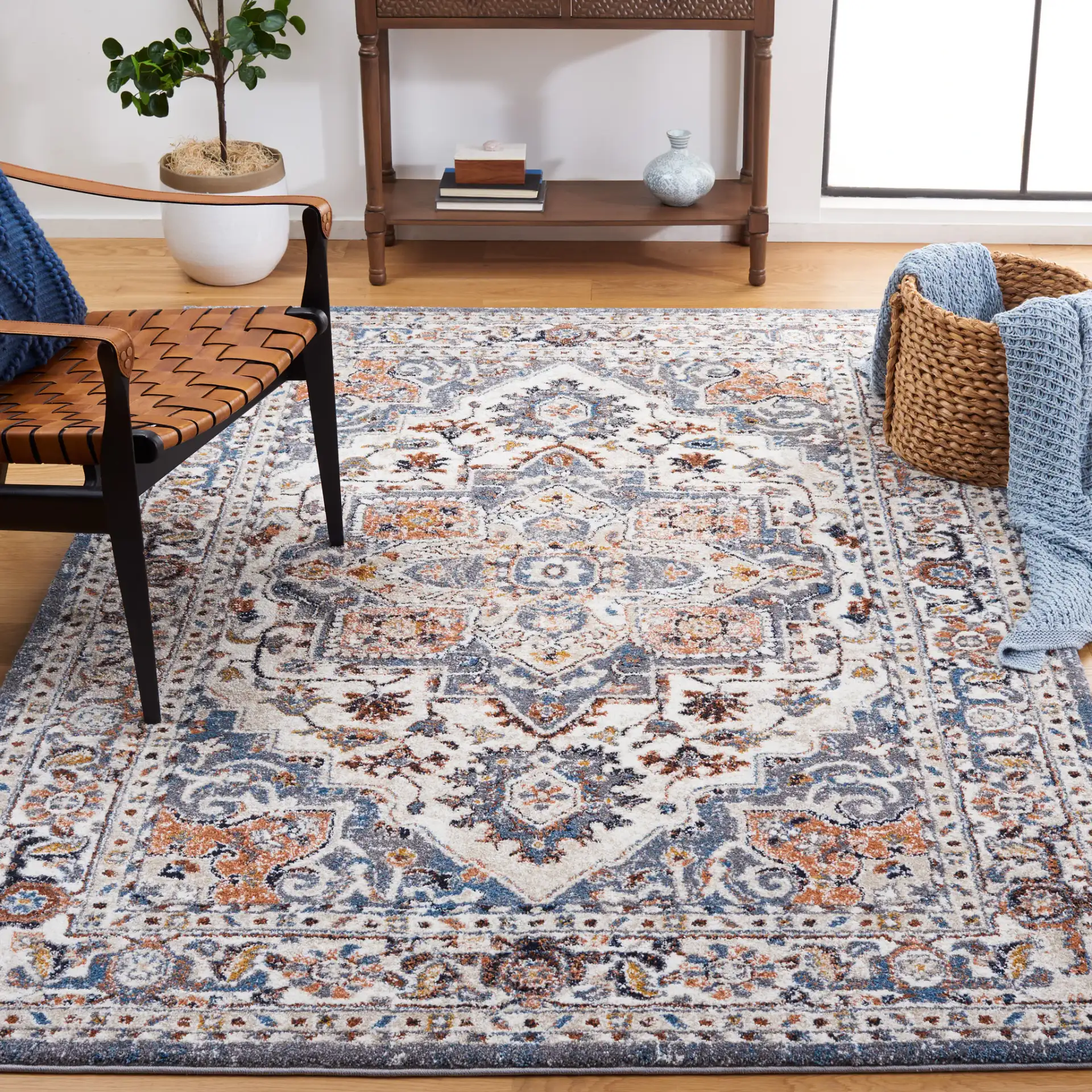 Symphony Medallion Bordered Rug in Ivory / Gray in a styled room