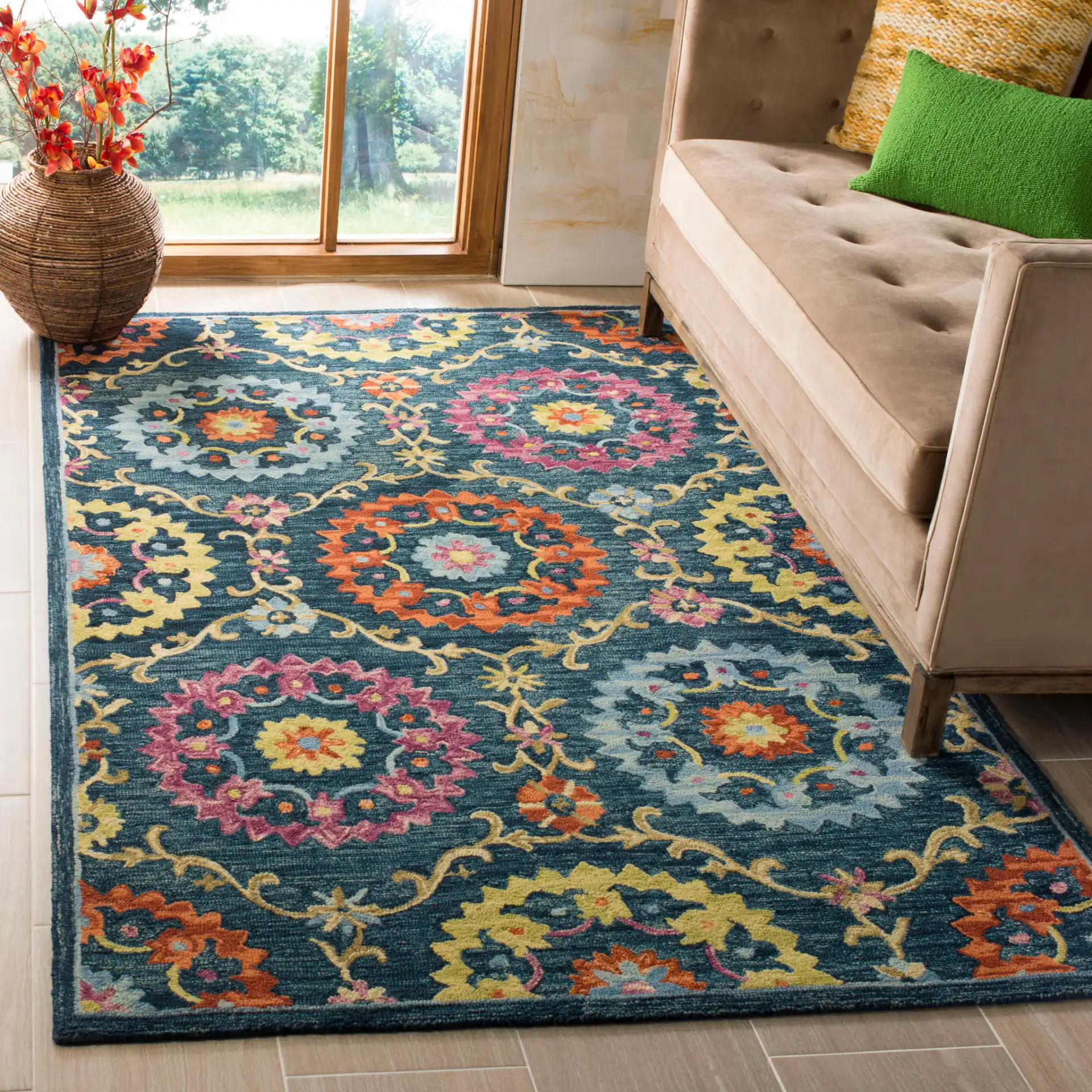 Suzani Rosette Trellis Hand-Hooked Wool Rug in Blue / Multicolor in a styled room
