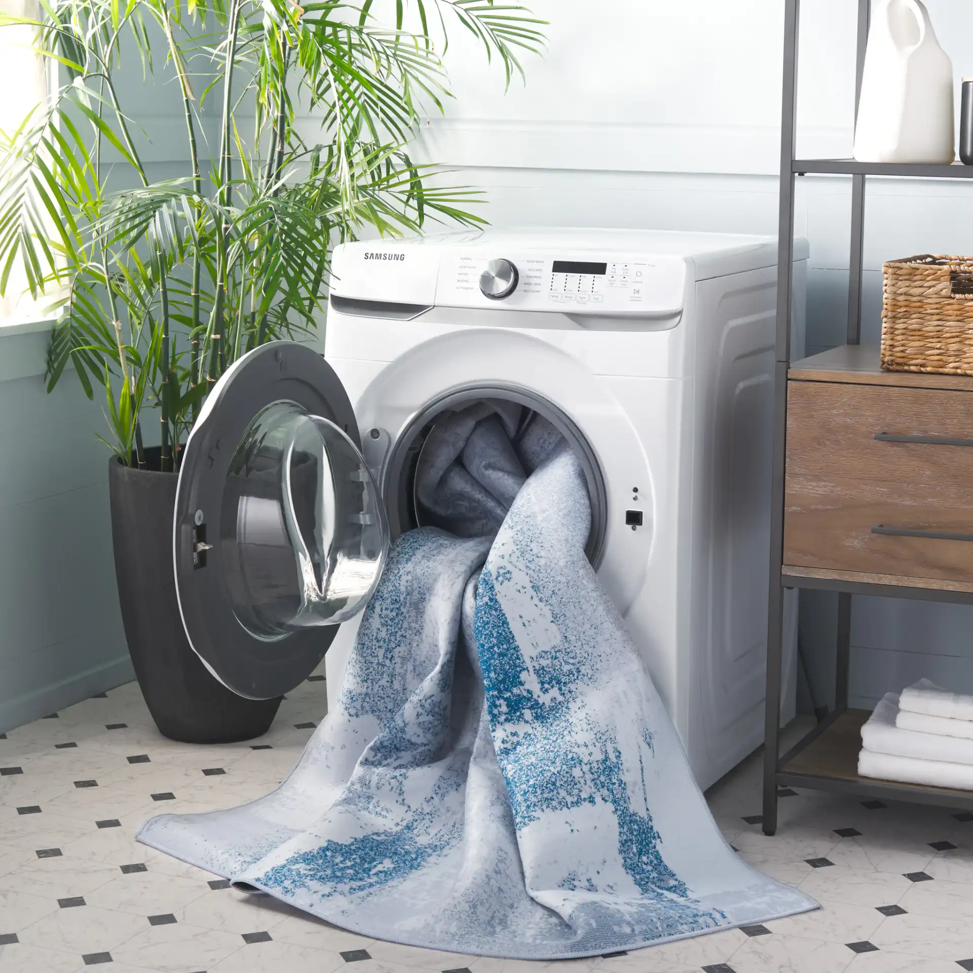 Tacoma Abstract Patchwork Washable Rug in Gray / Blue in a styled room