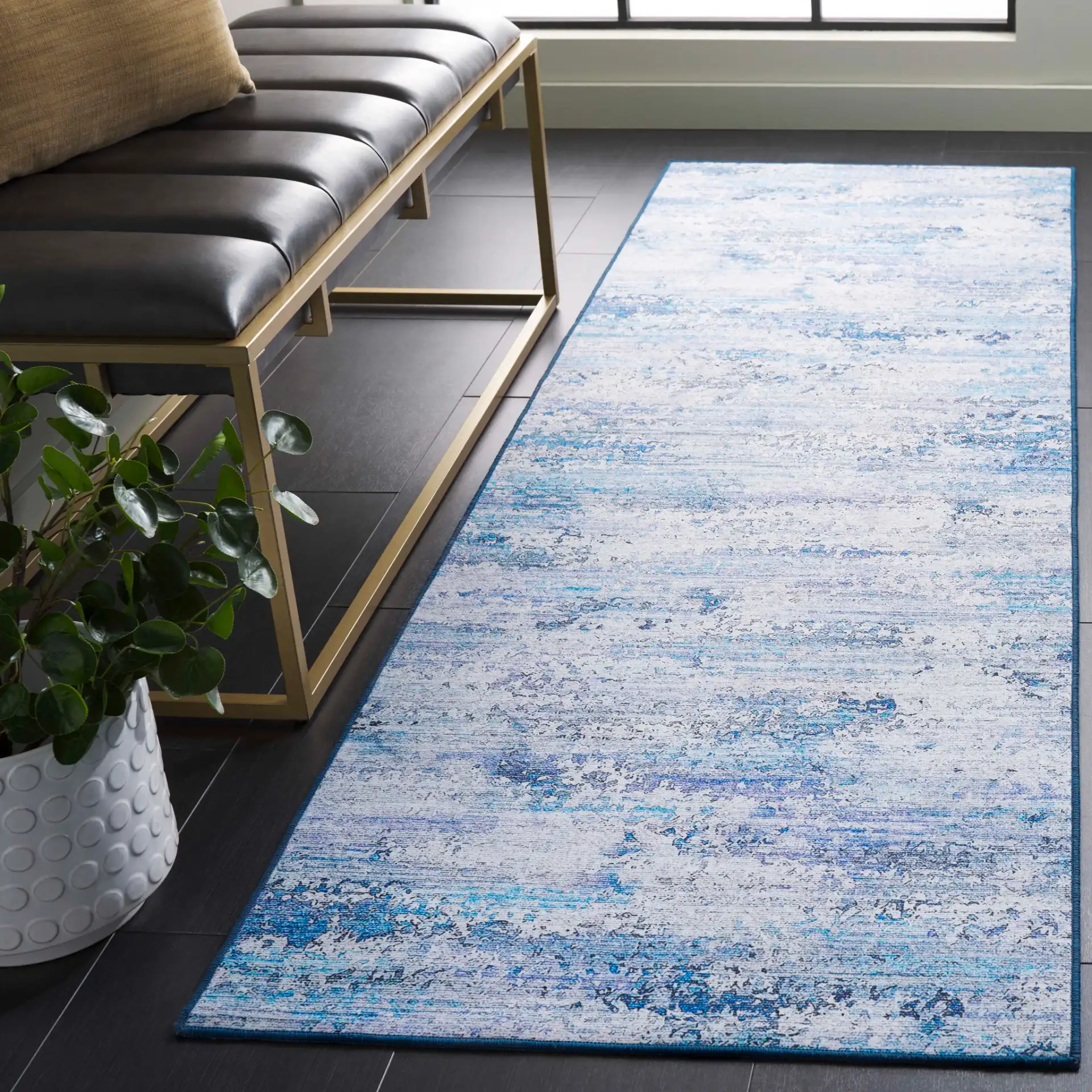 Tacoma Distressed Linear Washable Rug in Gray / Blue in a styled room