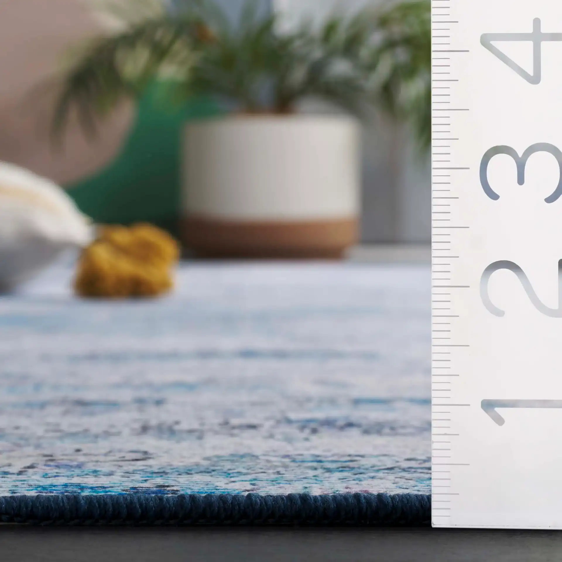 Tacoma Distressed Linear Washable Rug in Gray / Blue in a styled room