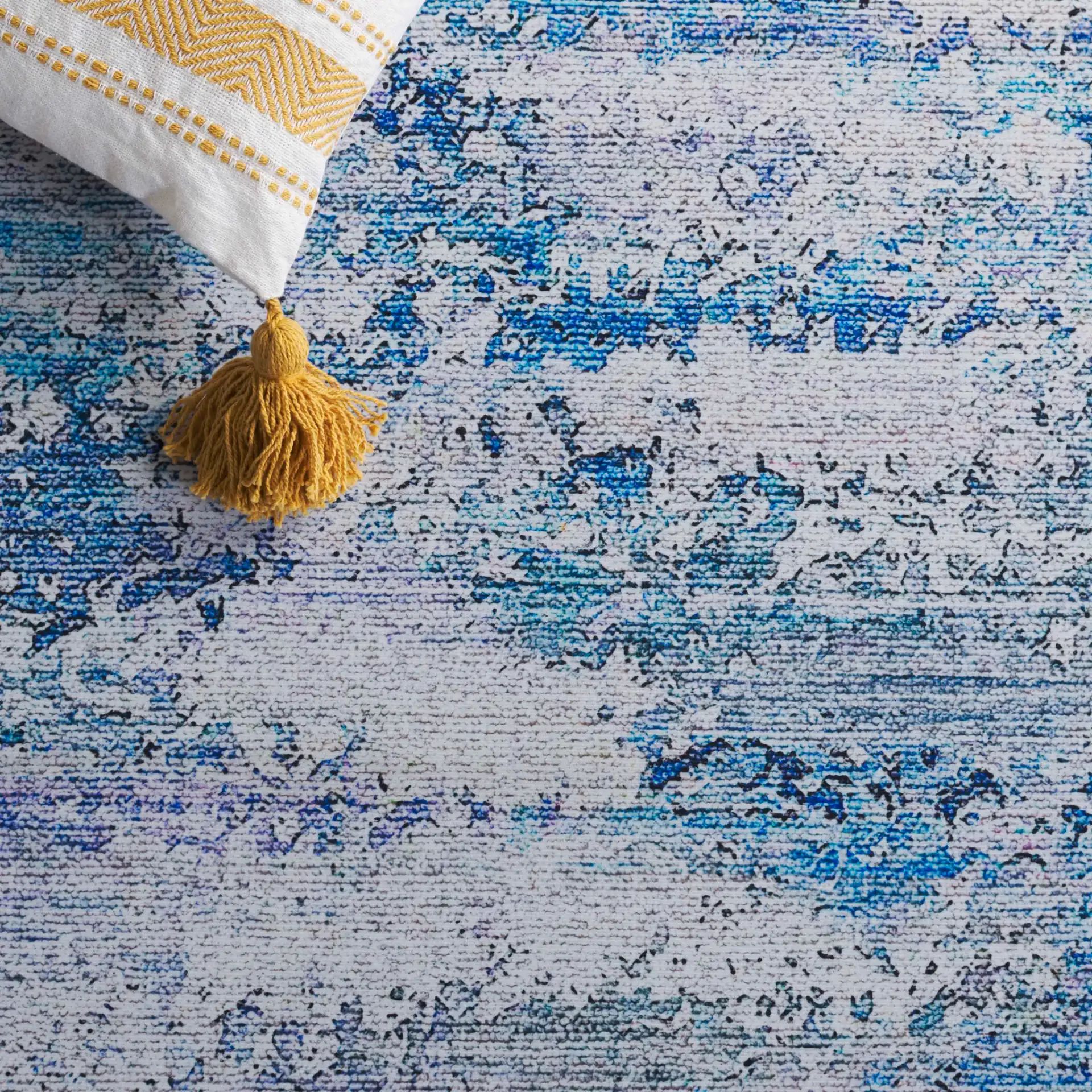 Tacoma Distressed Linear Washable Rug in Gray / Blue in a styled room