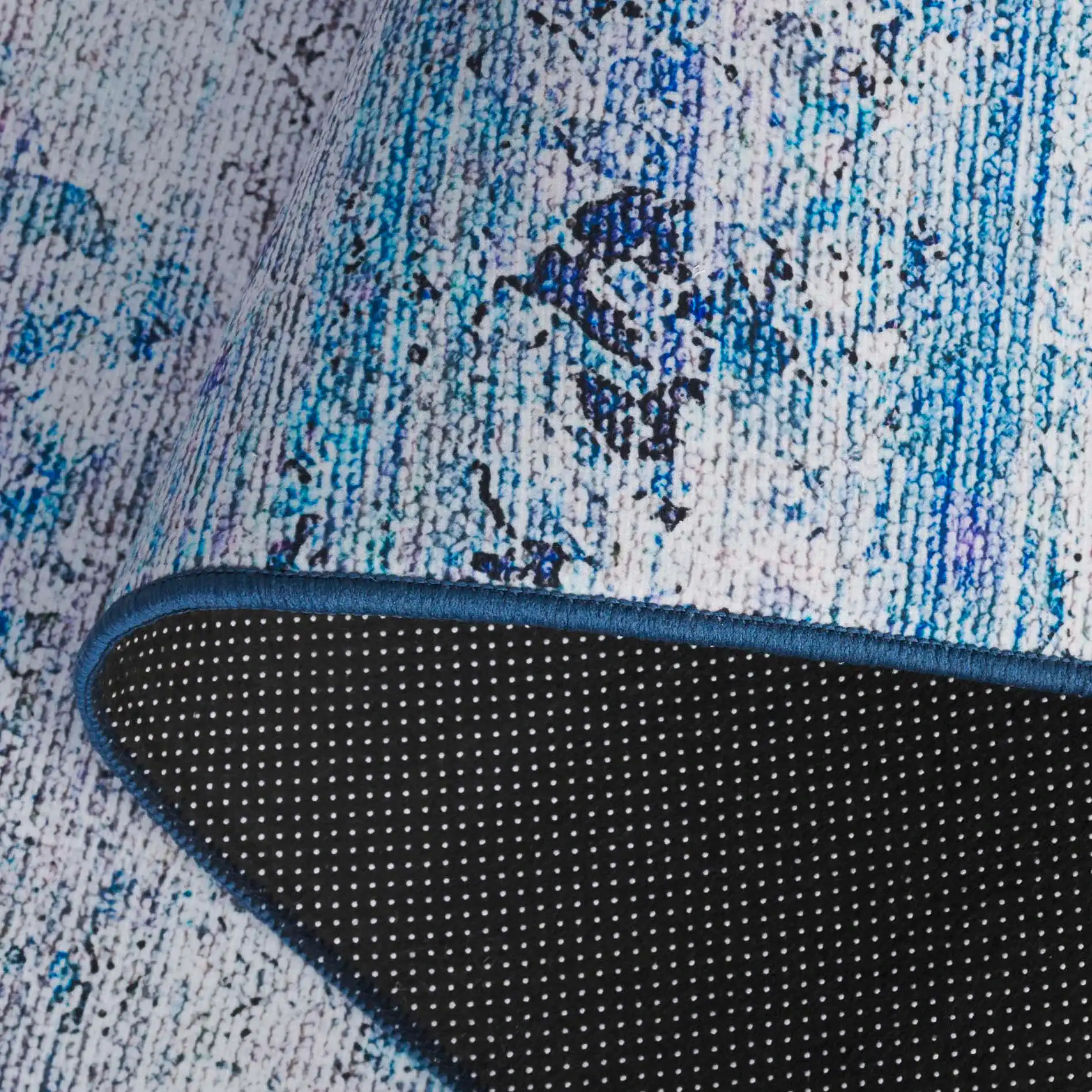 Tacoma Distressed Linear Washable Rug in Gray / Blue in a styled room