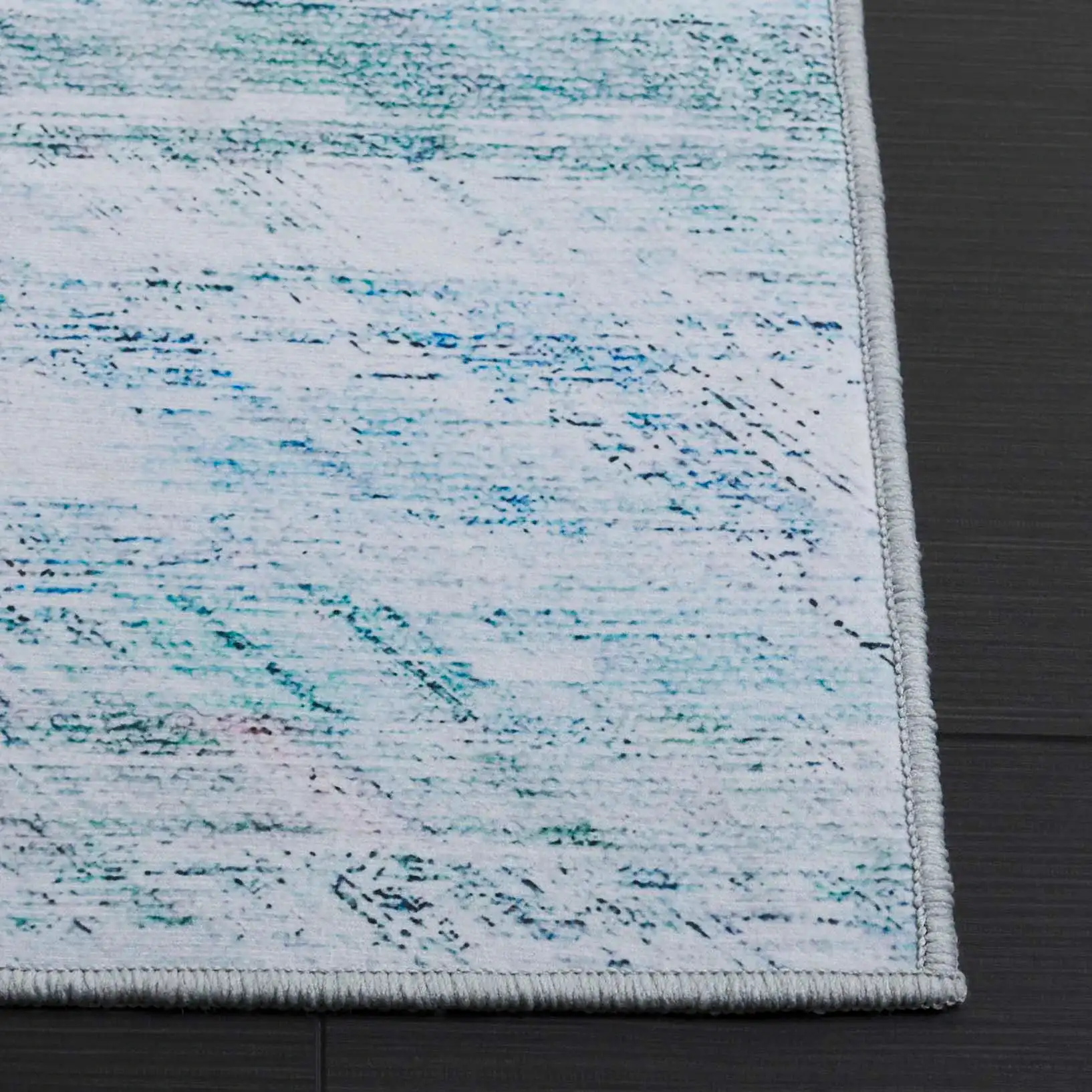 Tacoma Striated Abstract Washable Rug in Gray / Aqua in a styled room