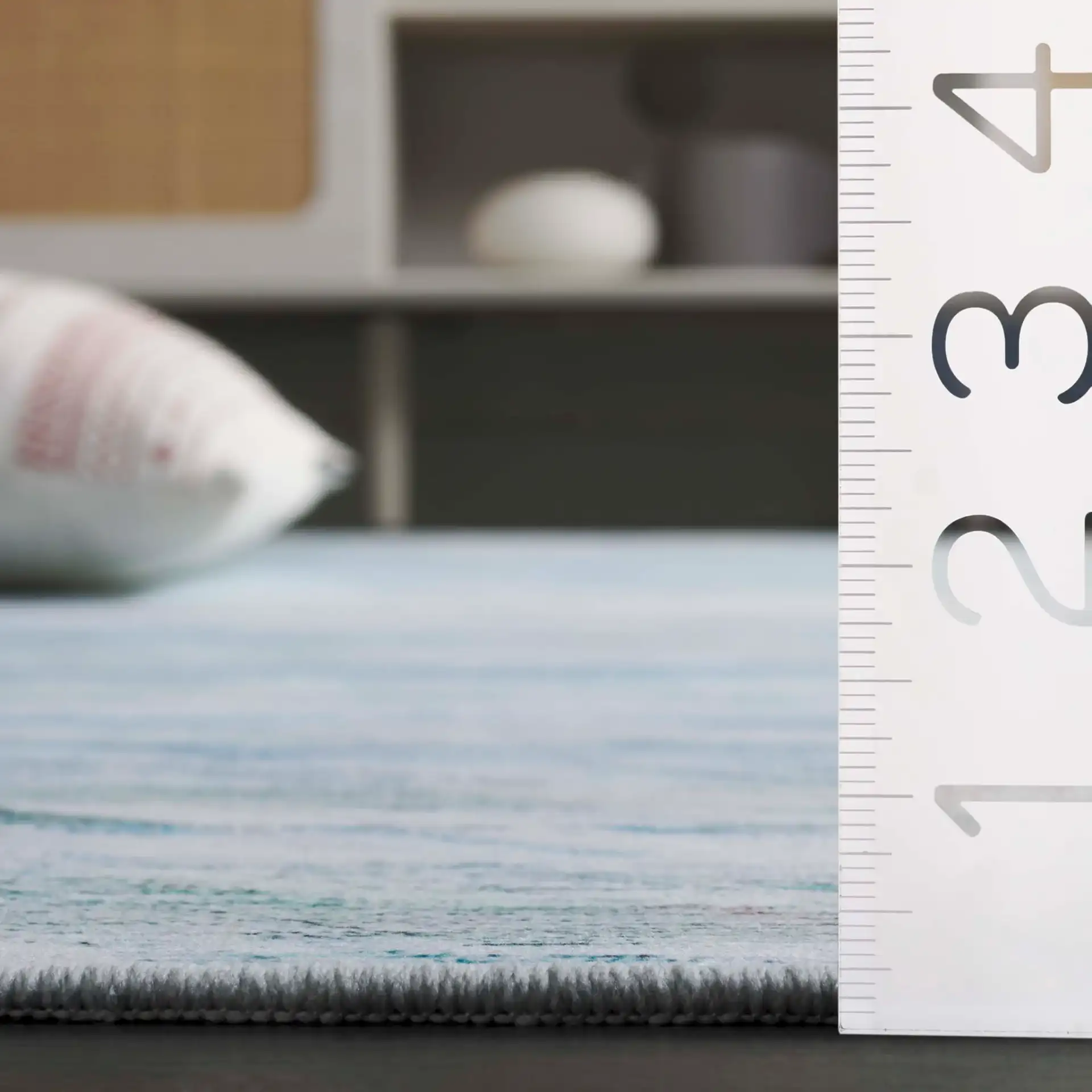Tacoma Striated Abstract Washable Rug in Gray / Aqua in a styled room